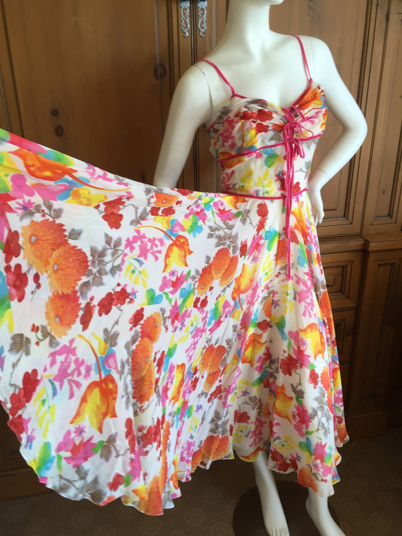 Christian Dior by John Galliano Festive Silk Floral Dress 
Perfect for a summer garden party
Trimmed in pink velvet ribbons, so chic
Size 36
Measurements: Bust 36