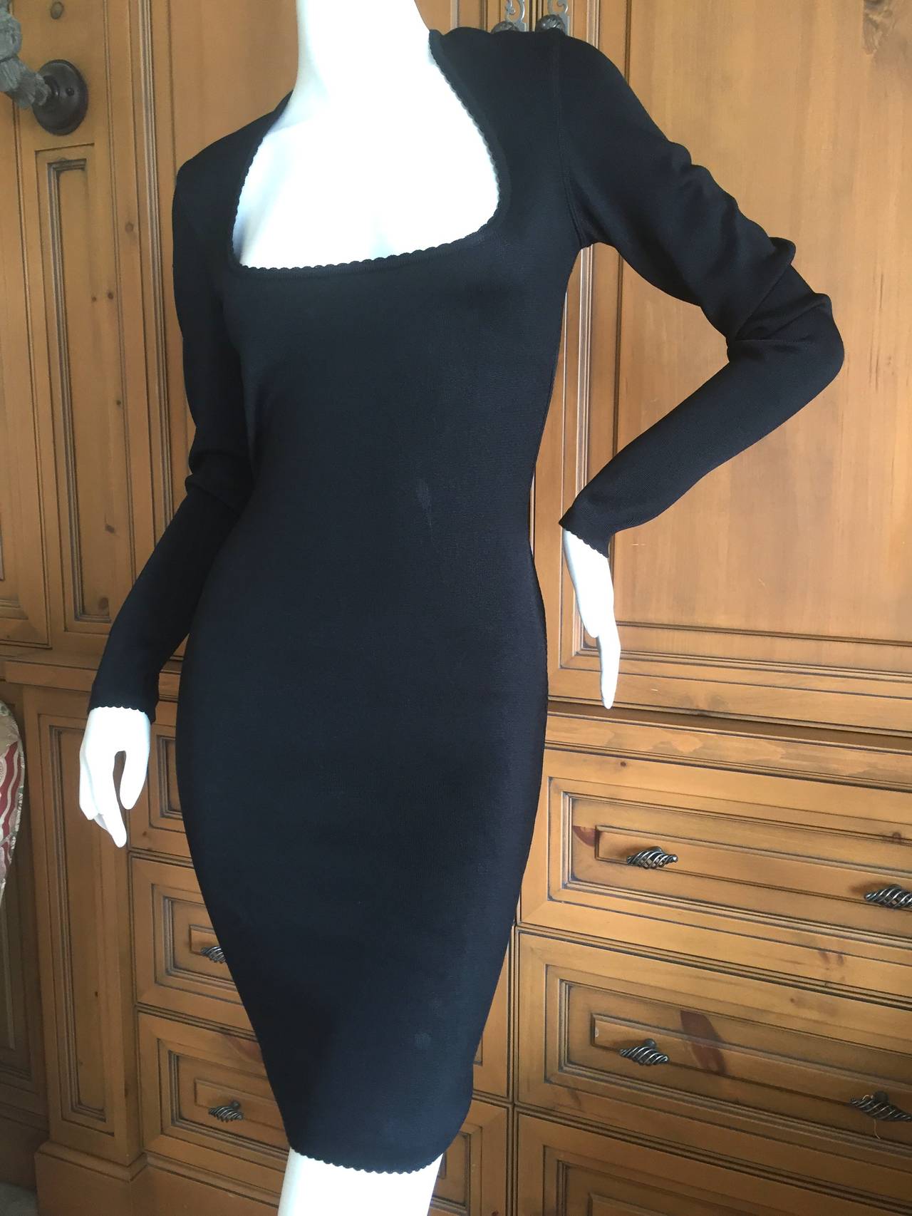 Azzedine Alaia Iconic 1980's Low Cut Little Black Mini Dress
This is the frontpiece in Alaia Book
Sz XS
The measurements in the listing is of the dress lying flat, with out stretching it.
There is a lot of stretch in this, they don't call him
