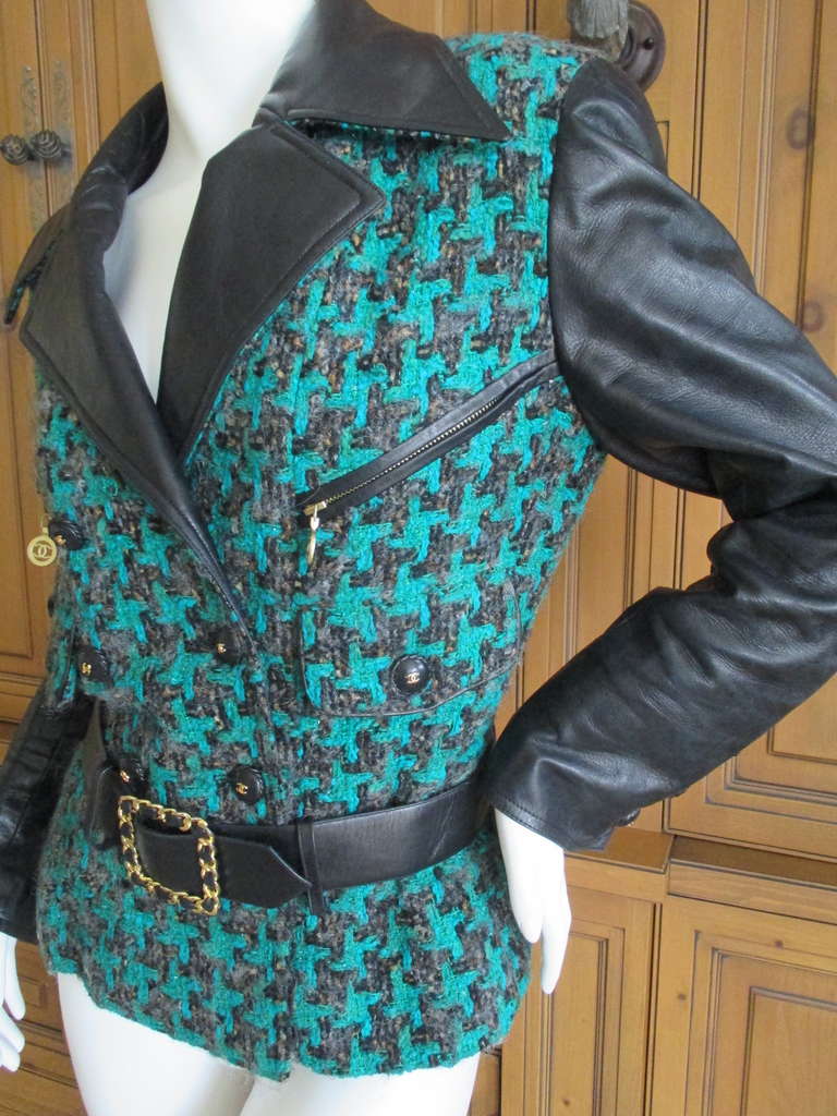 Chanel by Karl Lagerfeld 1991 Boucle Belted Jacket with Leather Sleeves.
A witty fantasy tweed in a green and black exagarrated herringbone pattern.
Glove soft lambskin, belt has woven gold chain buckle
This is not a heavy weight, could easily be