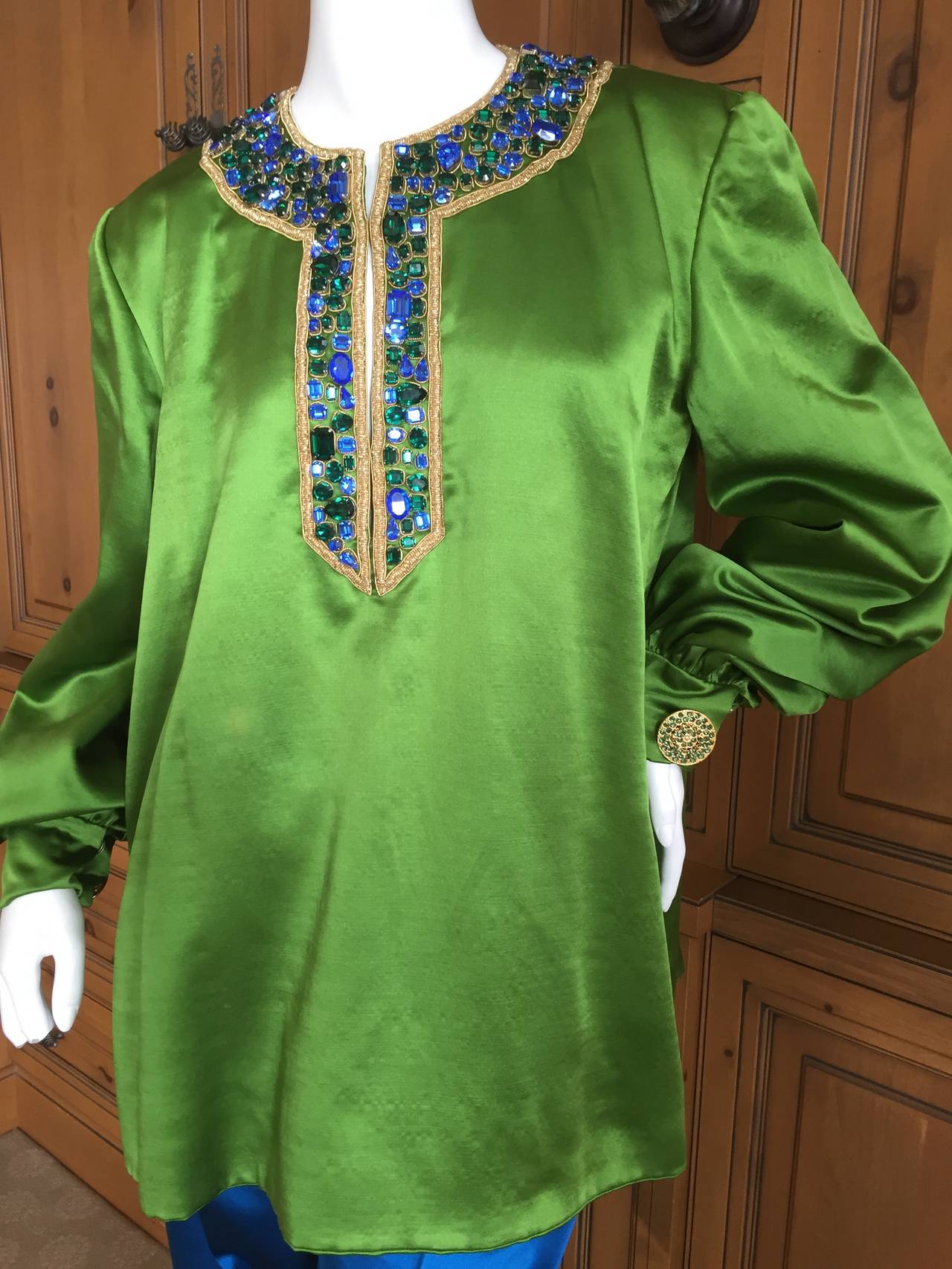 Beautiful Jewel tone silk duchesse satin tunic and pant suit from Givenchy Haute Couture circa 1990.
Emblazened with large Swarovski crystals  around yoke.
Cut large, this would be a size L.
This was in the Sotheby''s /Kerry Taylor Auction in