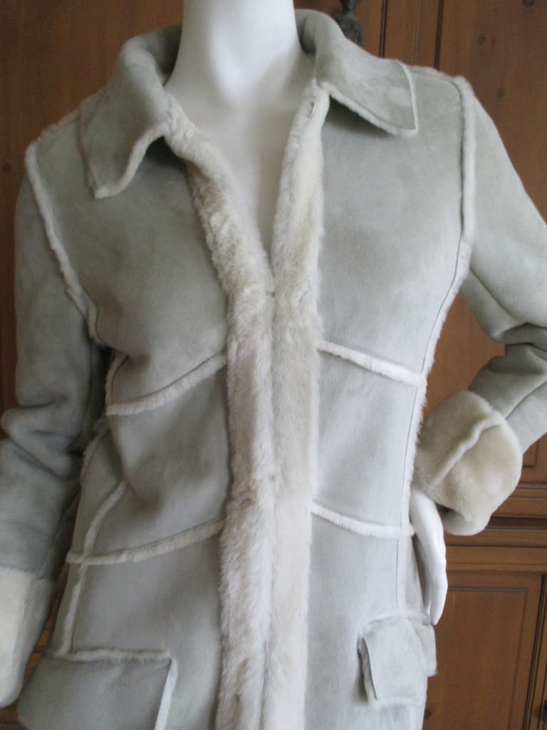 Chanel Chic Sage Sheepskin Shearling Jacket with Detachable Shearling Collar
A very pale sea foam/ sage color 
This is from a set, the suit (top and skirt) are also available .
This auction is for the shearling jacket only
   
A 2002

Bust: