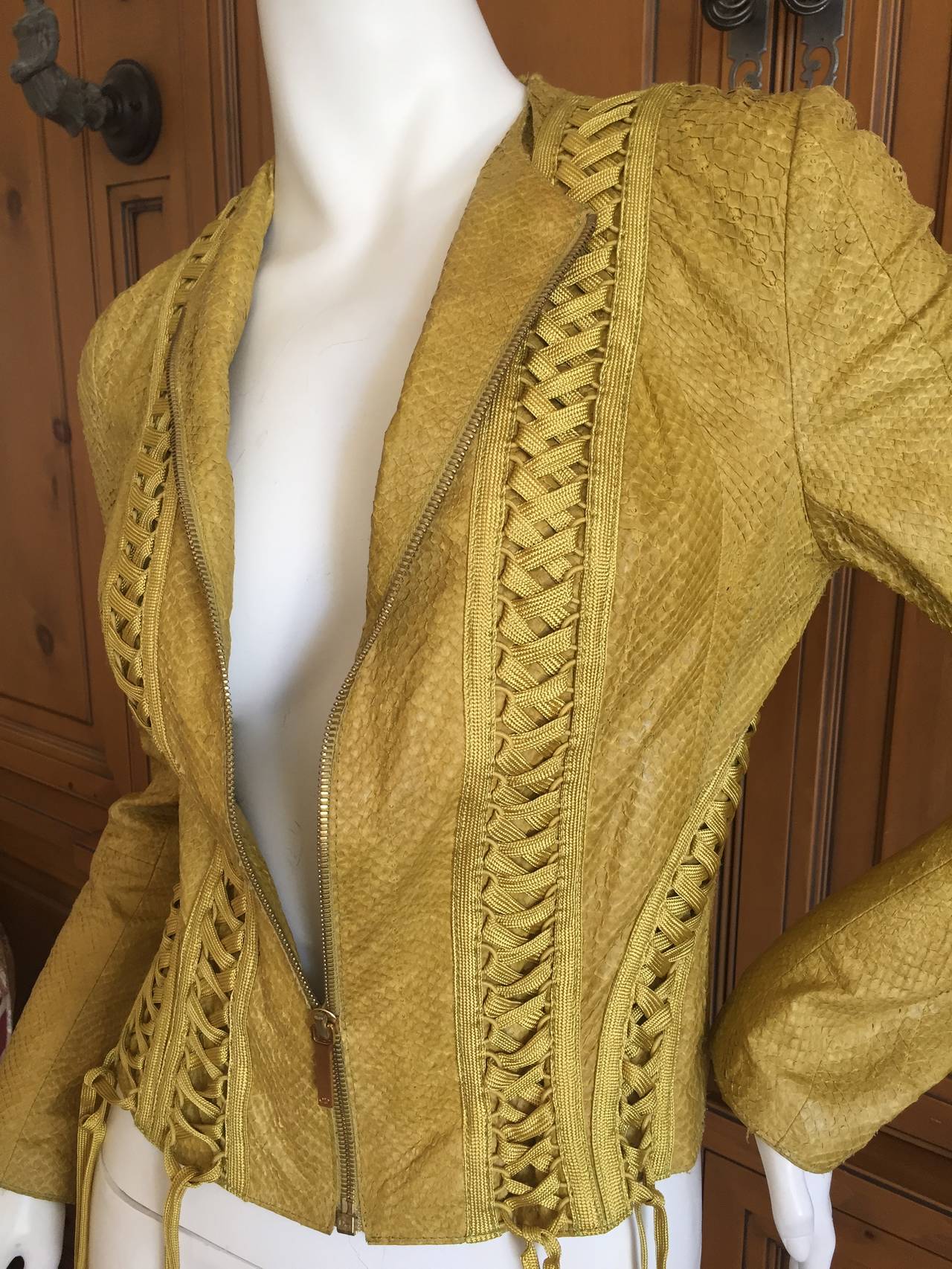 Christian Dior by John Galliano Exotic Skin Corset Lace Jacket.
Ochre colored with corset lacing .
This looks like a type of snakeskin but is created out of a type of fish skin.
Size 38
Bust 36