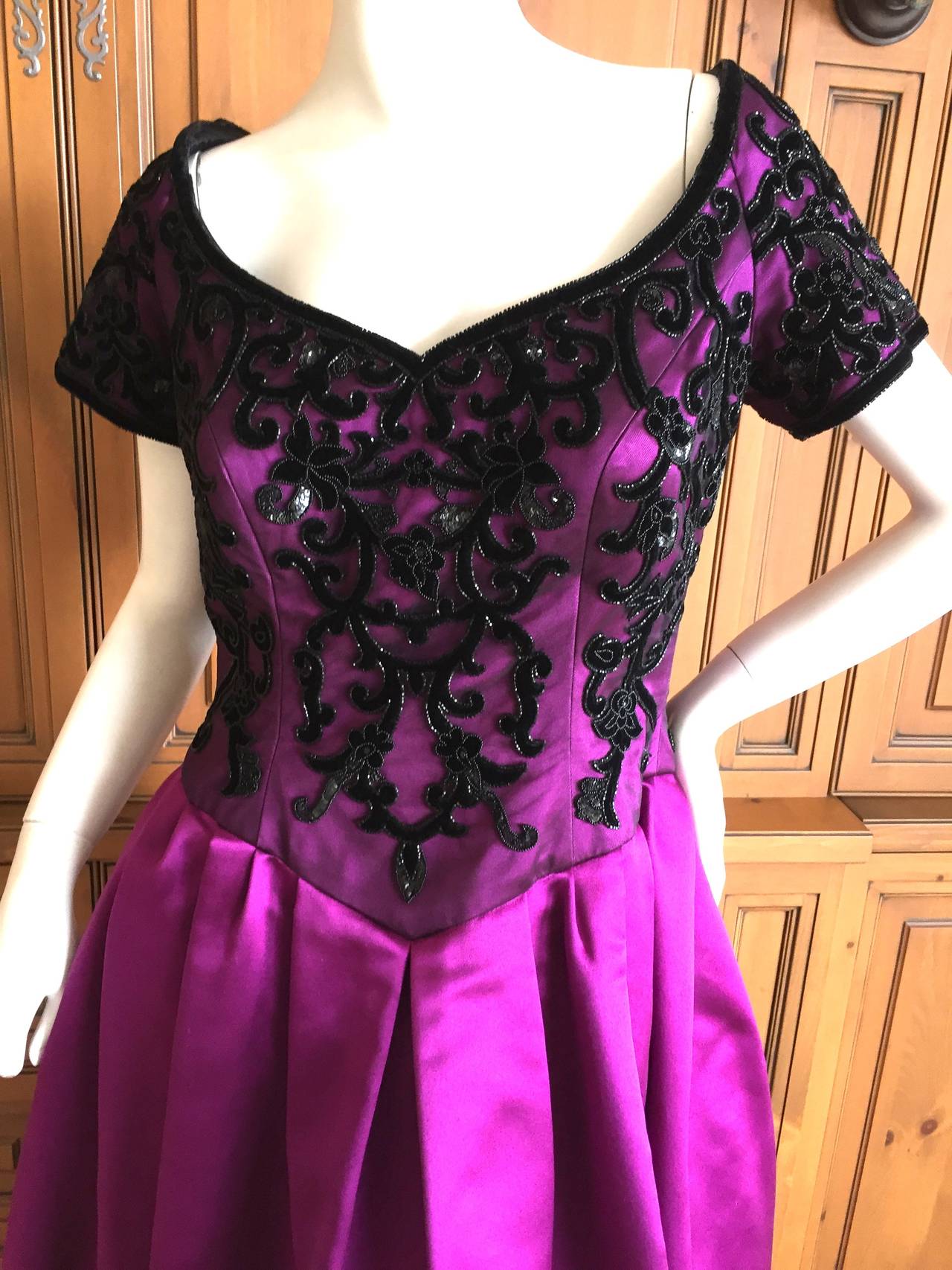 Escada Couture Enchanting Vintage Gown w Sequin Lace Details.
Deep pink silk with black beaded net bodice, very pretty.
Size 44
Bust 39
Waist 32