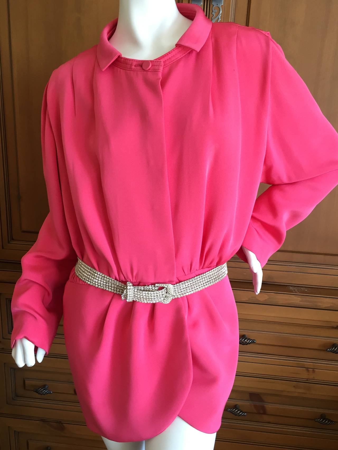 Shocking pink silk top/jacket from James Galanos for I Magnin.
I'm not certain if this is a jacket or a blouse. 
Gathered at the waist, with hidden buttons.
I believe there were shoulder pads originally , which must have been removed to modernize