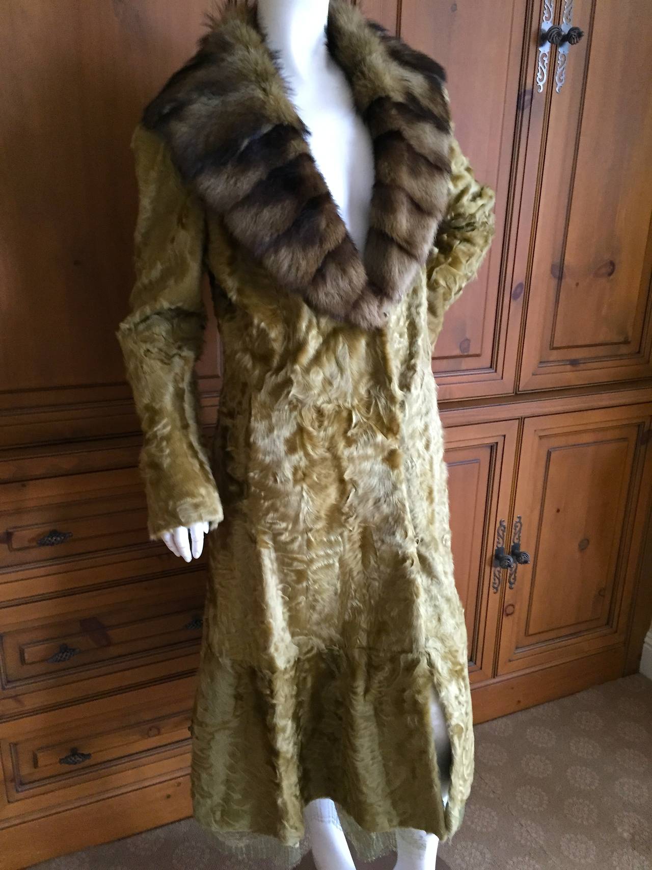 Beautiful green broadtail lamb coat from Zac Pozen for Neiman Marcus.
This is so beautiful, with a wide brown fur collar.
This has a generous 86
