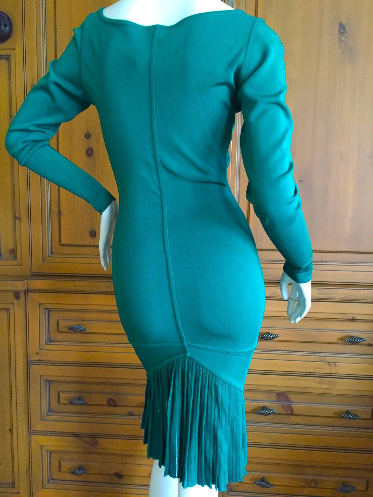 Sexy green dress with a fishtail back from Azzedine Alaia circa 1990.

Appx Size L
There is a lot of stretch in this dress
Bust 36