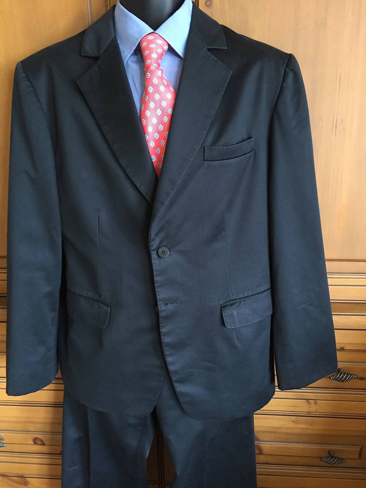 Exquisitely tailored black cotton mens suit from Chado Ralph Rucci.
Custom tailored by the Chado seamstresses who are some of the most skilled in the world.
Soft fine cotton, with the most luxurious silk lining.
Working sleeve buttons ,there are