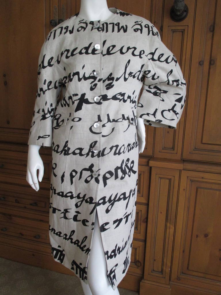 Stunning Chado Ralph Rucci coat.
Linen  with 8% cotton, lined in silk with mother of pearl buttons.
Calligraphy in different languages wrap around the coat.
The attention to detail and subtle patterns are pure Ralph.
Retail was $4800.
Looks