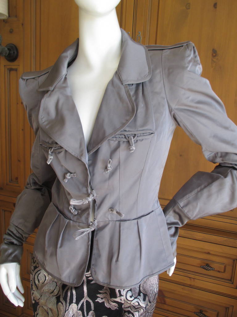 Yves Saint Laurent Tom Ford Fall 2002 Pagoda Jacket and  Skirt
Silver gray silk jacket .
Jacket is marked sz 38, the skirt is marked size 36
Jacket;
Bust 40