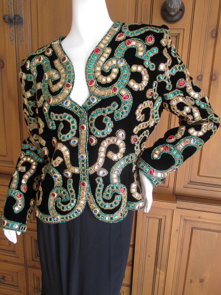 Oscar de la Renta Incredible Vintage Byzantine Inspired Jeweled Evening Jacket.
Covered in Jewel Tone Cabachons, this is absolutely stunning.
Circa 1980's, they don't make them like this anymore.
Oscar truly was a master at exotic ornamentation,