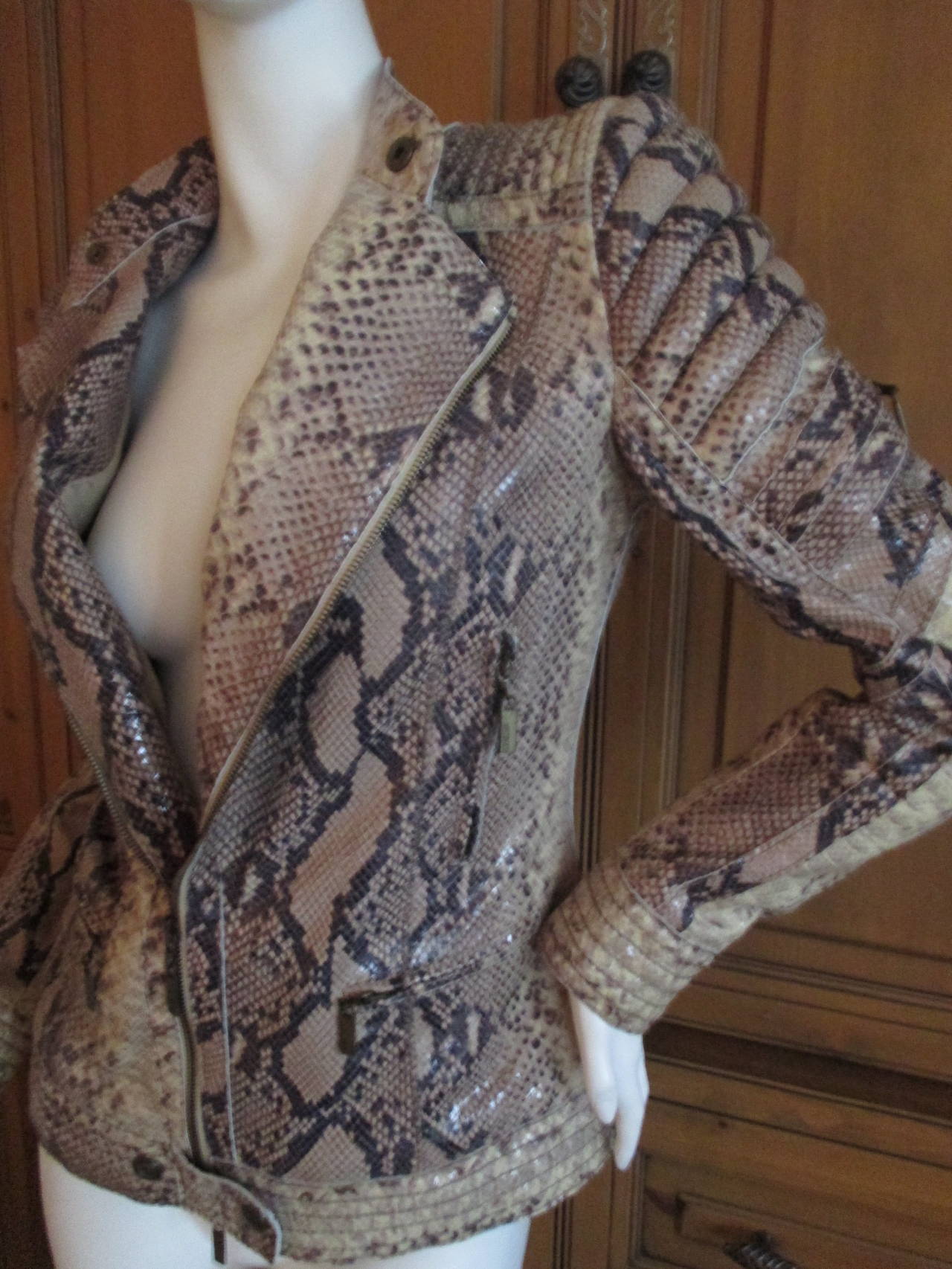 Roberto Cavalli Rocking Python Moto Jacket for Just Cavalli

This jacket has it going on in so many ways. Please check out the futuristic details with the zoom feature.

I'm not certain if it is genuine python or python treated leather .

It