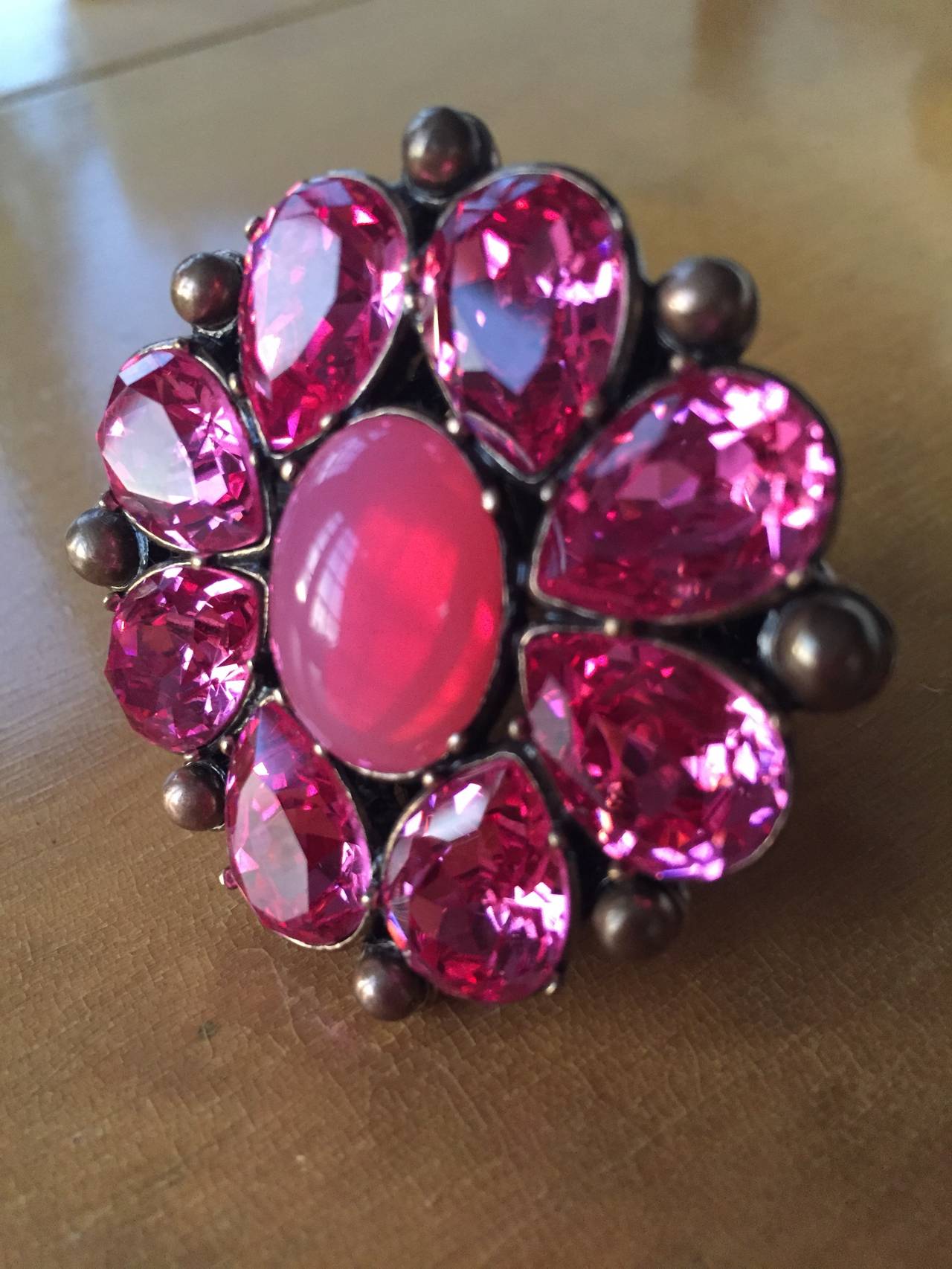 Wonderful Large Christian Dior Ring
Brass tone with pink stones
Ornament measures 2