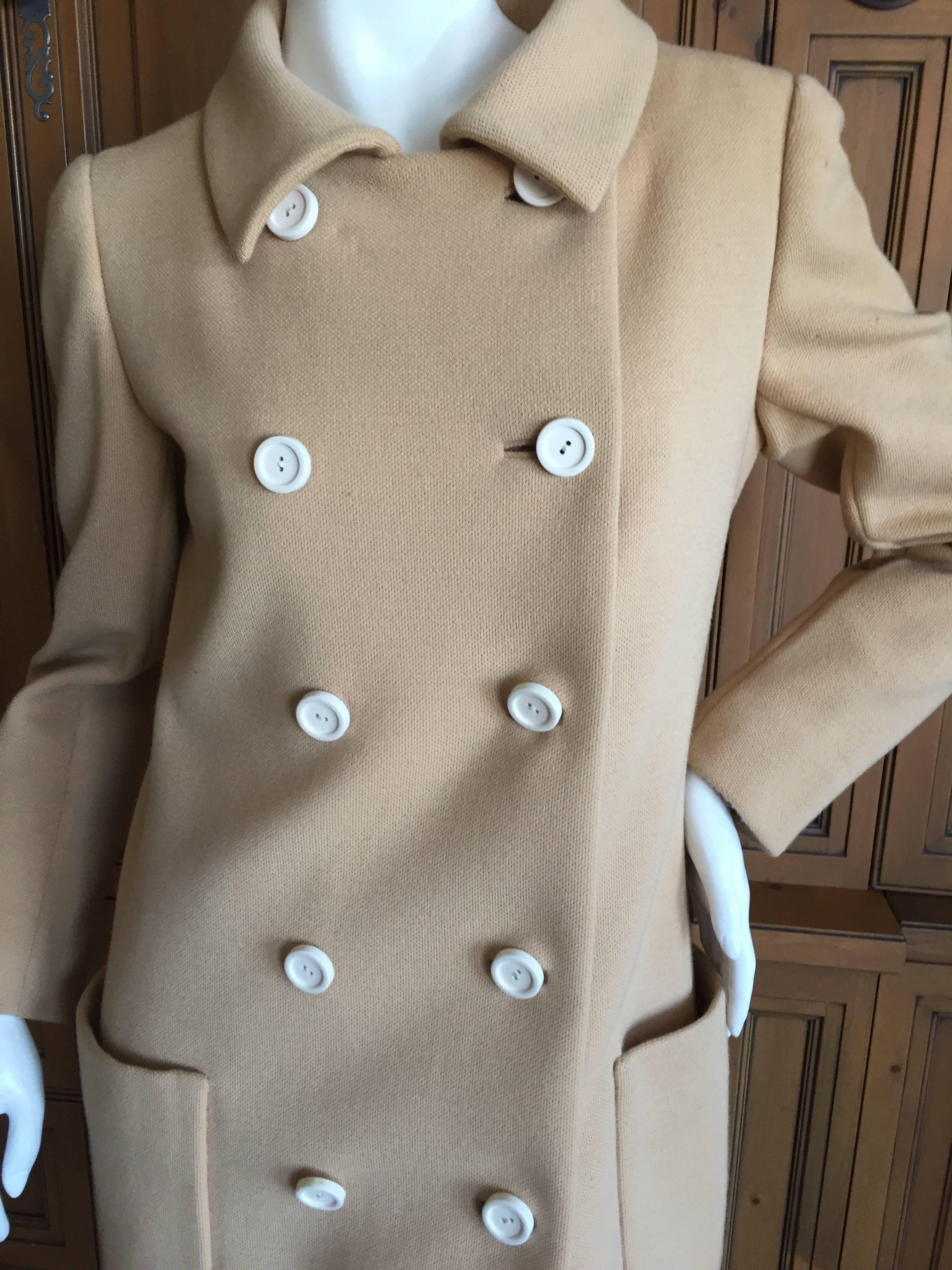 Norman Norell 1960 Light Brown Coat.
Lined in silk taffeta with working sleeve buttons.
Norell was considered Haute Couture in America and the prices were very expensive.
Bust 39