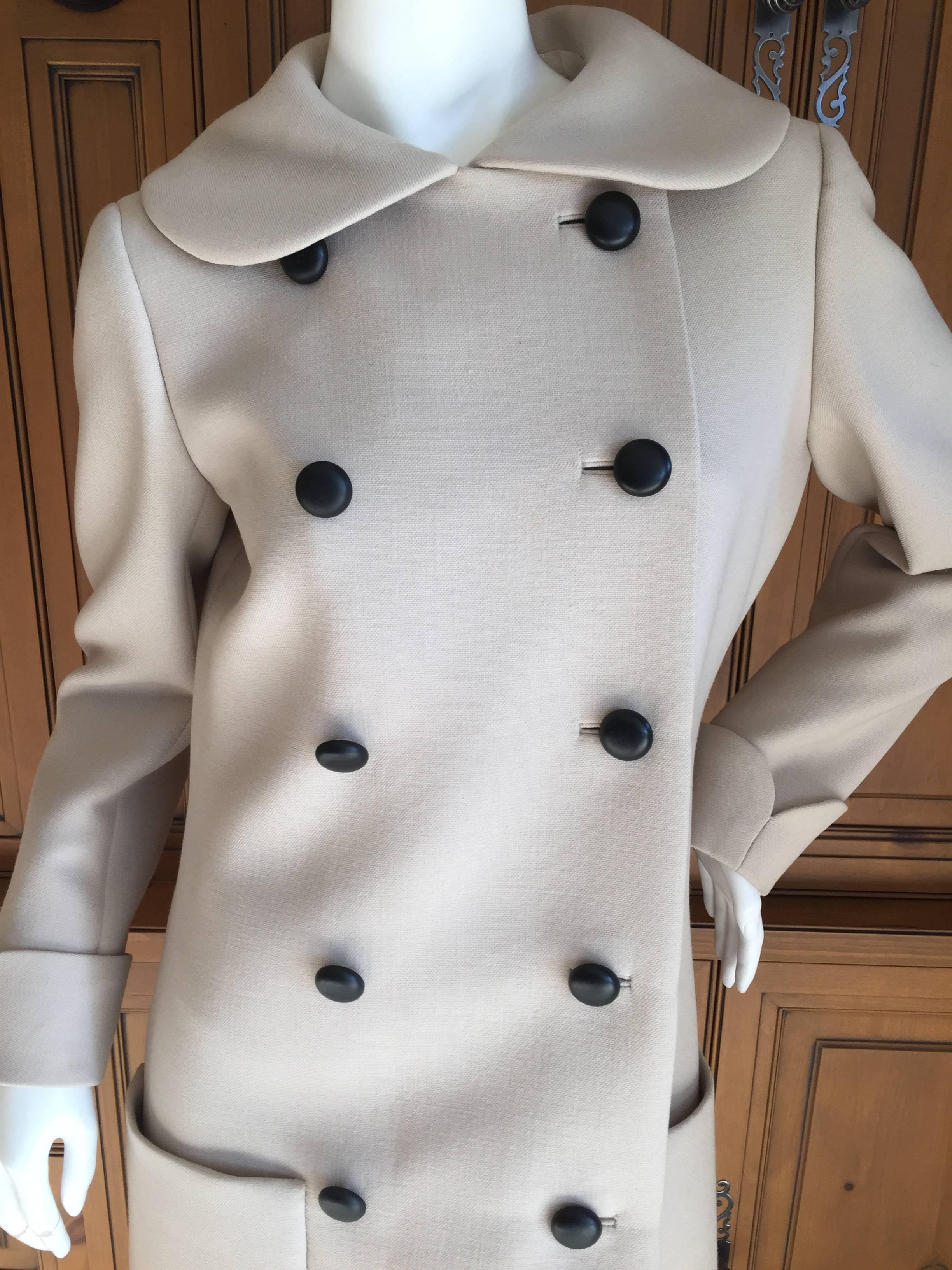 Delightful 1960's tan wool peacoat from Norman Norell.
Lined in silk taffeta with working sleeve buttons.
Bust 39