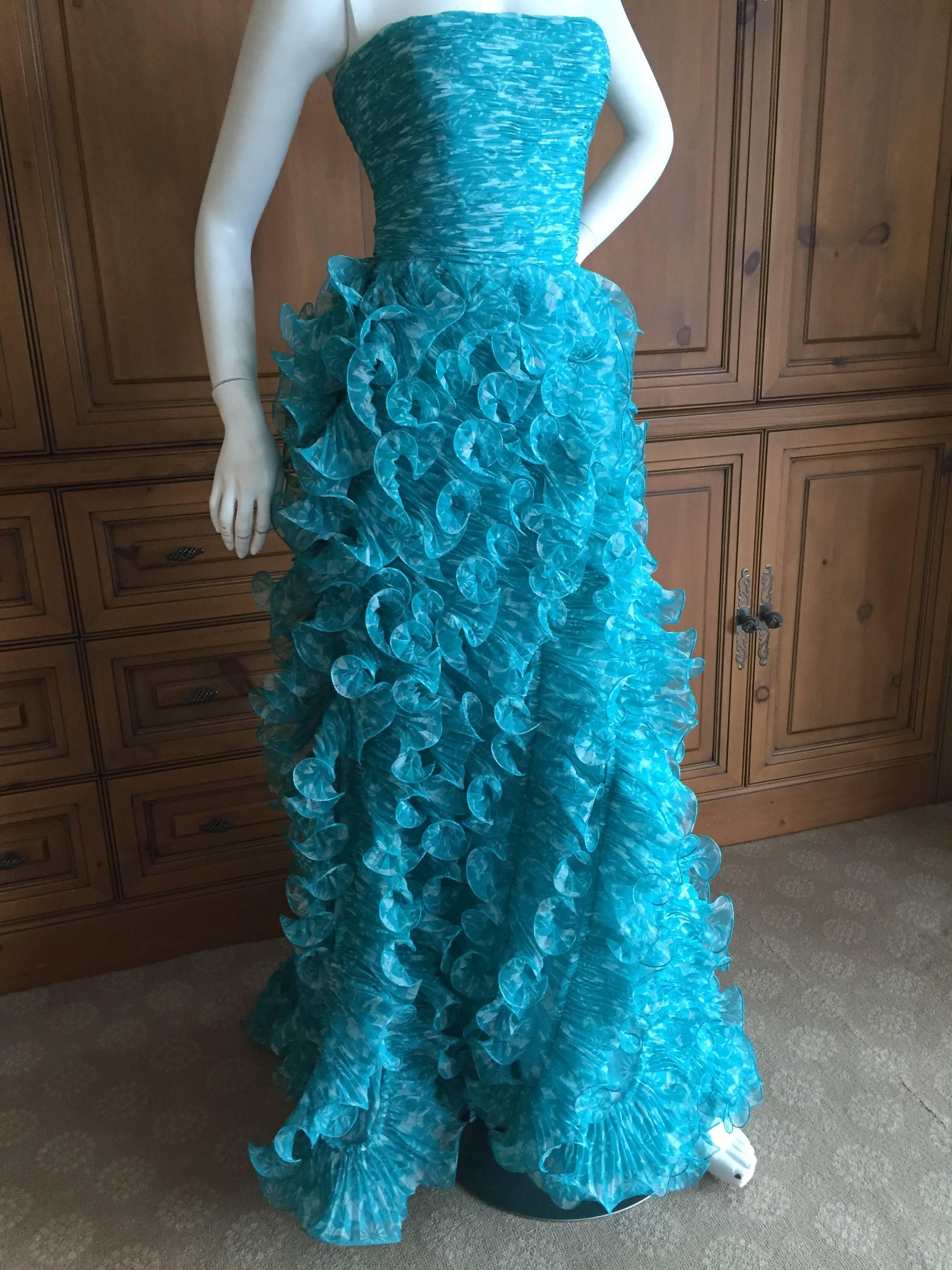 Oscar de la Renta Terrific Turquoise Vintage Ruffled Strapless Evening Gown

Featuring a full interior corset, the fabric looks like shimmering Caribbean waves, so pretty. 
Size 2

Bust 34