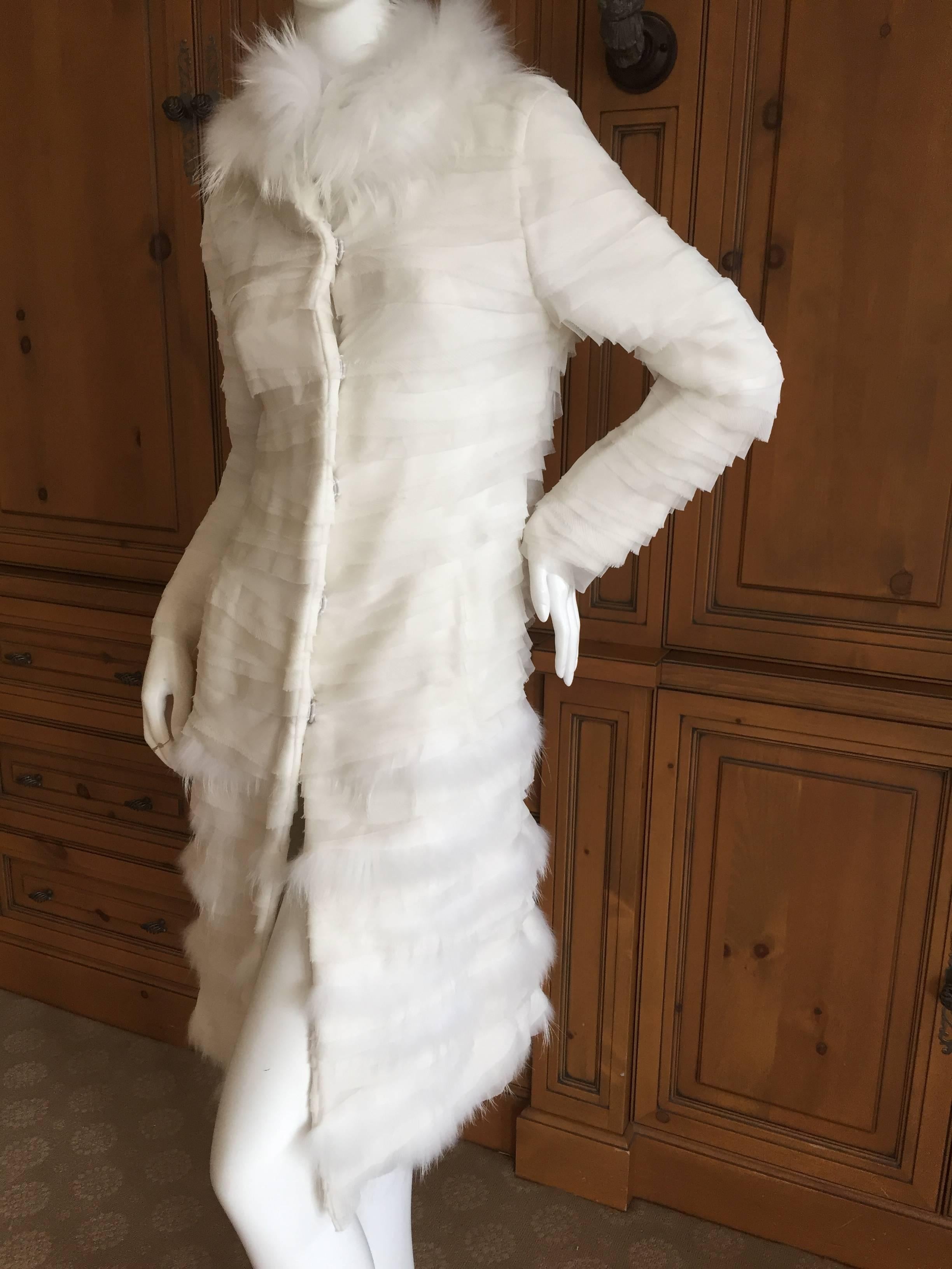 Beautiful Oscar de la Renta Luxurious White Fur Trimmed Tiered Silk Coat .
Layers of white silk alternating with delicate white fur
Size 2-4
This is such a pretty piece, the photos don't quite capture its charms.

Bust 36