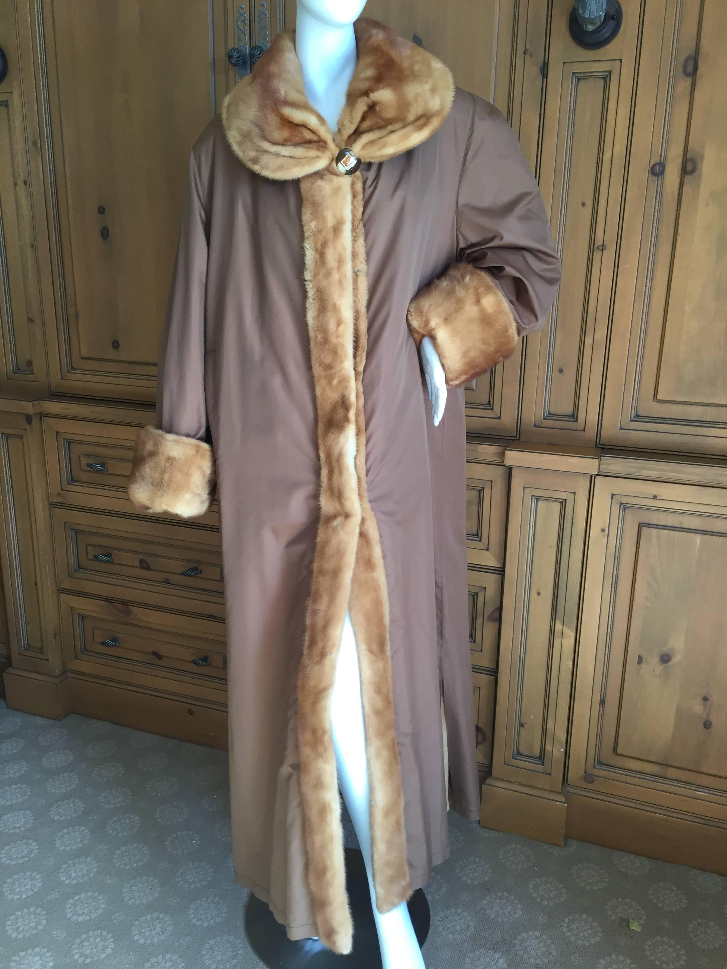 Beautiful reversible floor length coat from Fendi.

One side is a brown taffeta fabric, the other in rich golden brown mink fur.

Purchased at Fendi boutique .

Bust 50