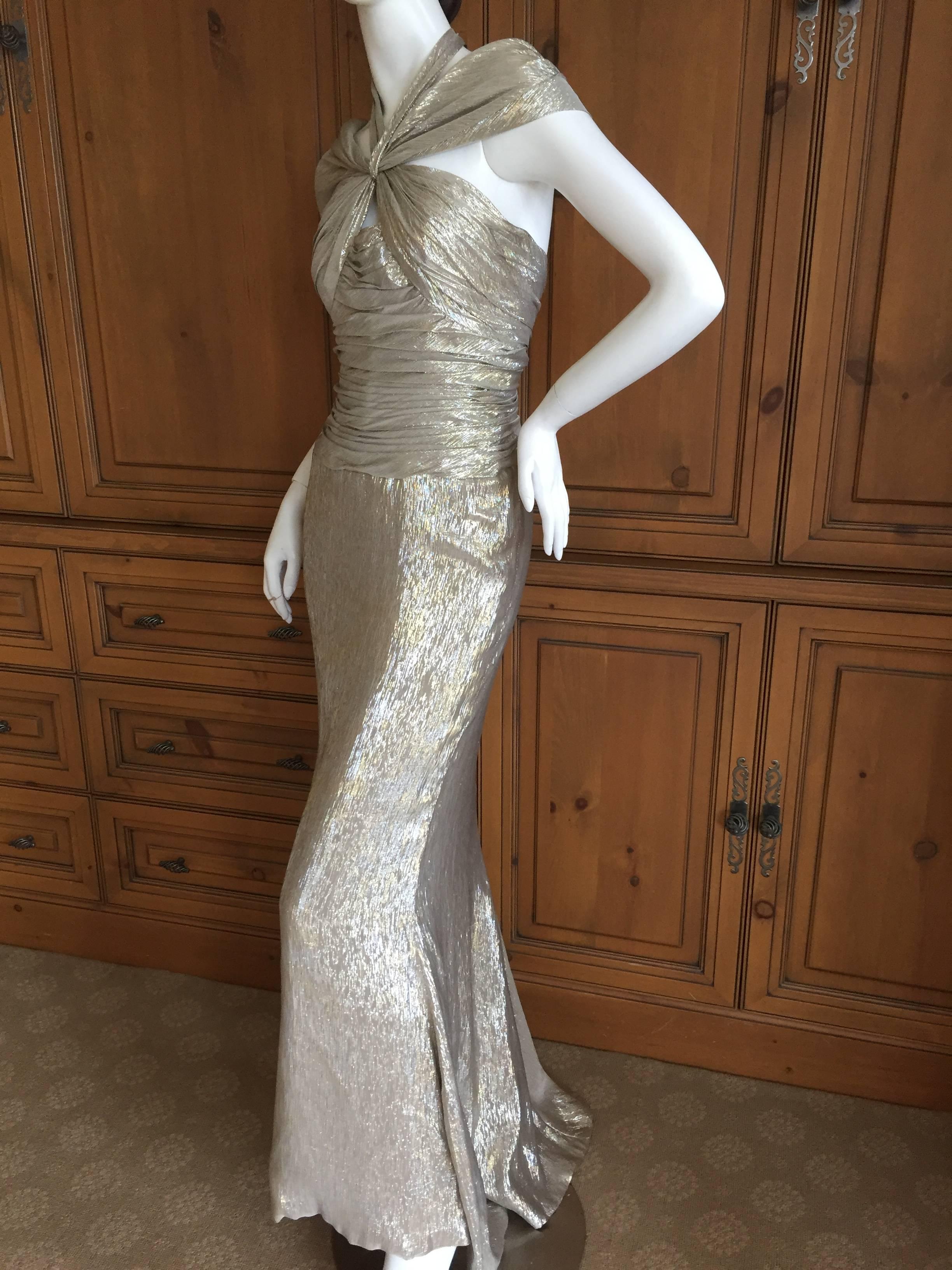 Beautiful Oscar de la Renta Romantic Metallic Silk Siren Gown .
This is such a pretty piece, the photos don't quite capture its charms.
The silk is shot through with gold and silver metallic thread, so pretty.
Size 4
Bust 34