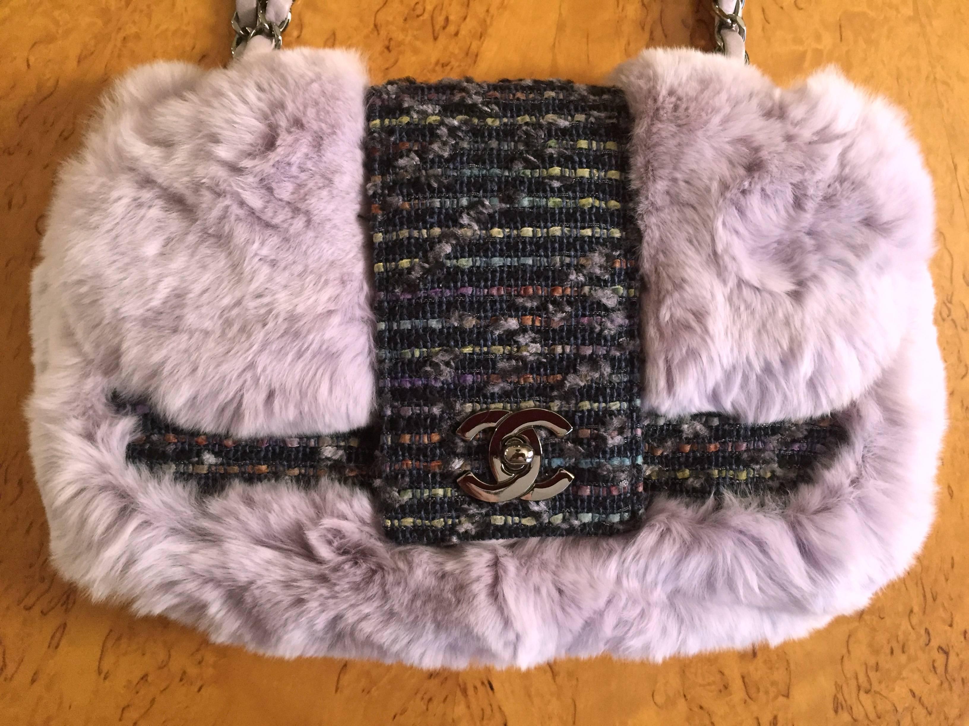 Chanel Exquisite Rare Limited Edition Fur and Tweed Flap Bag with CC Turn Lock .

Chinchilla Rex (Lapine) in a luscious shade of pale lavender gray.
Gunmetal hardware.
One inside compartment with side pocket
10