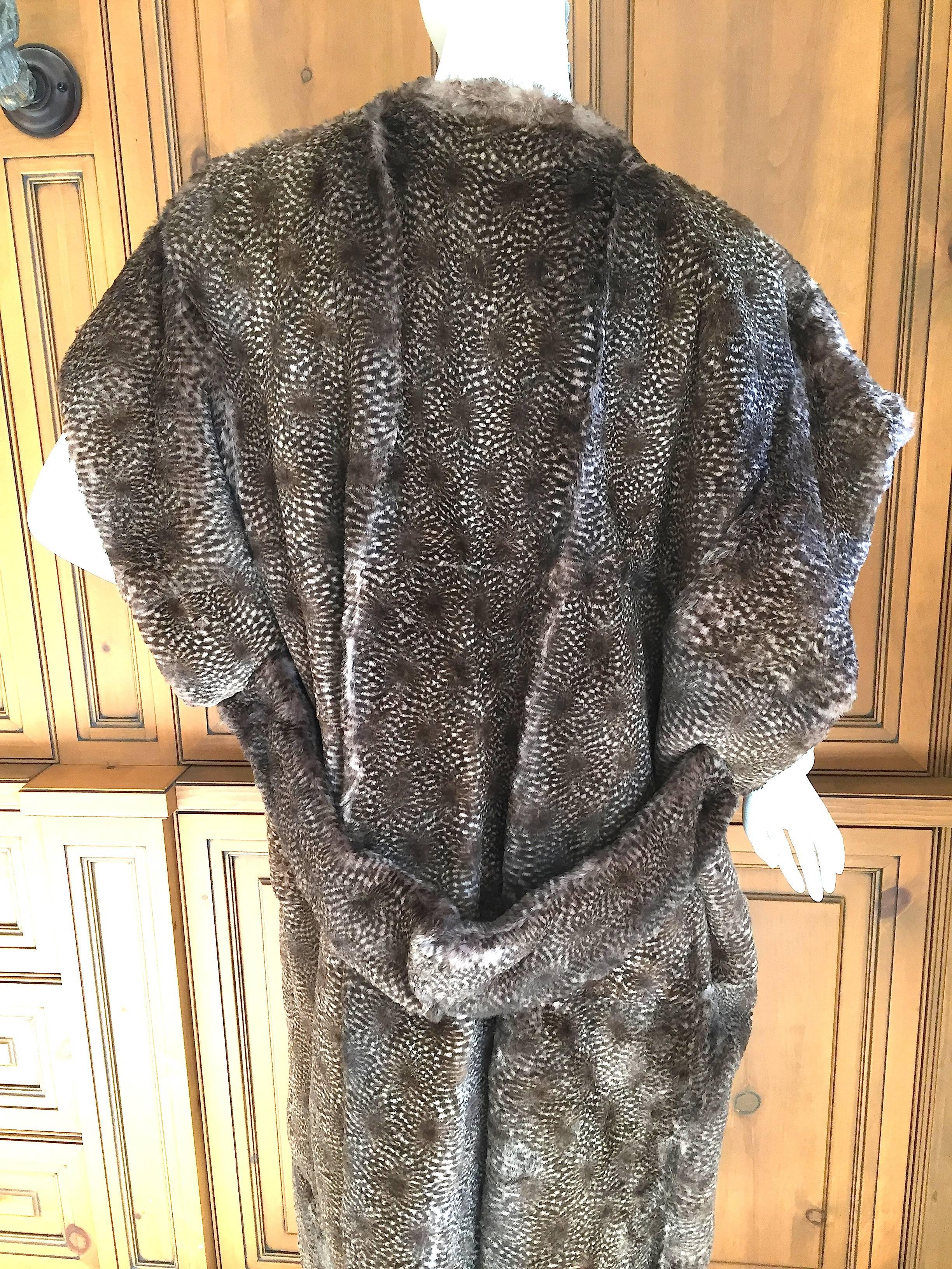 Beautiful long fur vest from Karl Lagerfeld for Fendi , circa 1985.
Very unusual pattern, like turkey feathers, very pretty.
Lined in Logo fabric , from I. Magnin , San Francisco.
I'm not certain of the fur type perhaps sheared beaver, perhaps