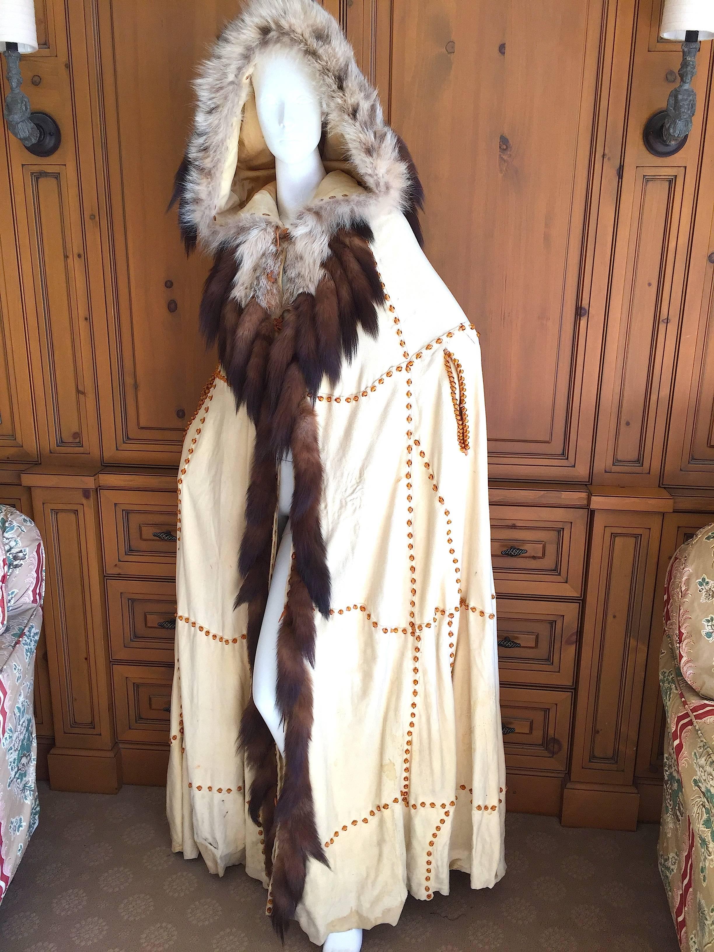 Floor sweeping deerskin cape embellished with fox and sable tails, this is quite the Wild West entrance maker.
From a wonderful gal who made her home in Aspen, truly for the western princess.
Bold topaz color glass beads crisscross this great