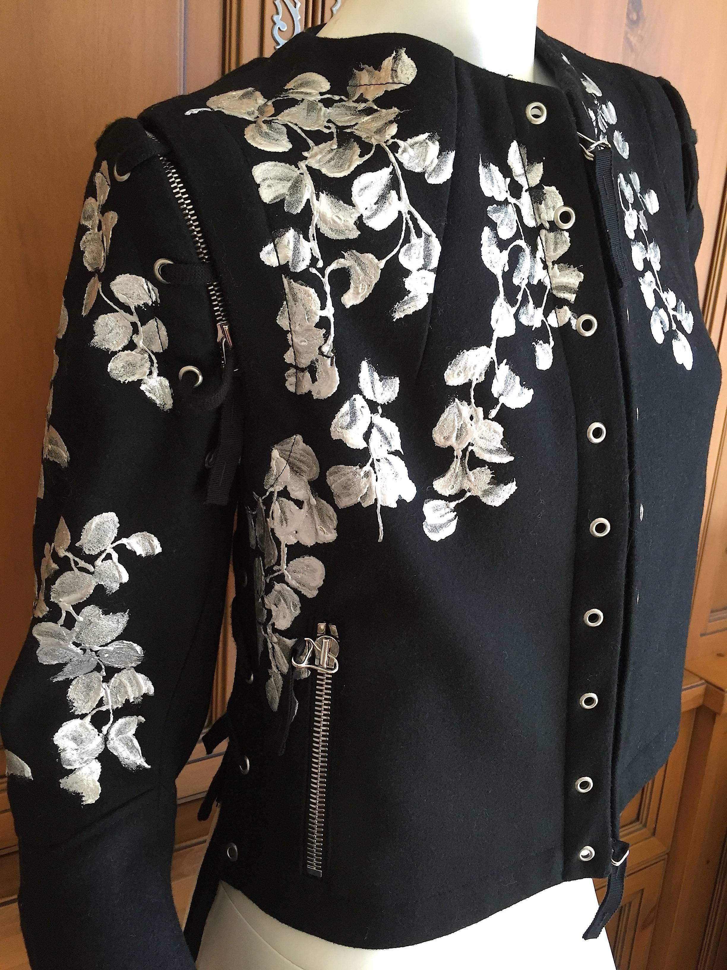 Beautiful hand painted black moto jacket from Dries van Noten.
Wisteria painted in silver trail down this amazing jacket. There are zippers everywhere on this, but I don't know if the sleeves actually come off or they are decorative.
Size 42
Bust