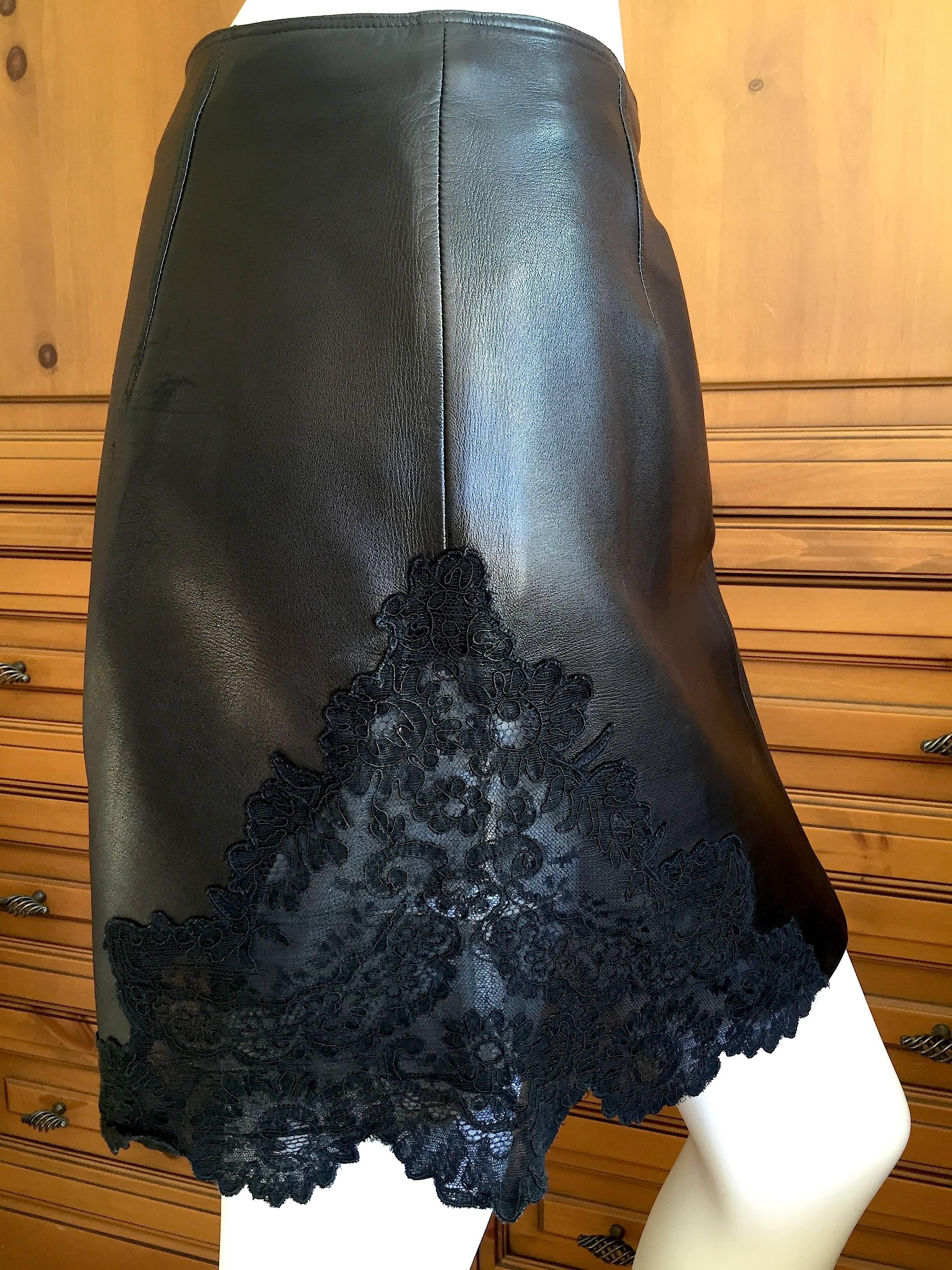 Beautiful black leather skirt with lace insert from Gianni Verscace,
Waist 29