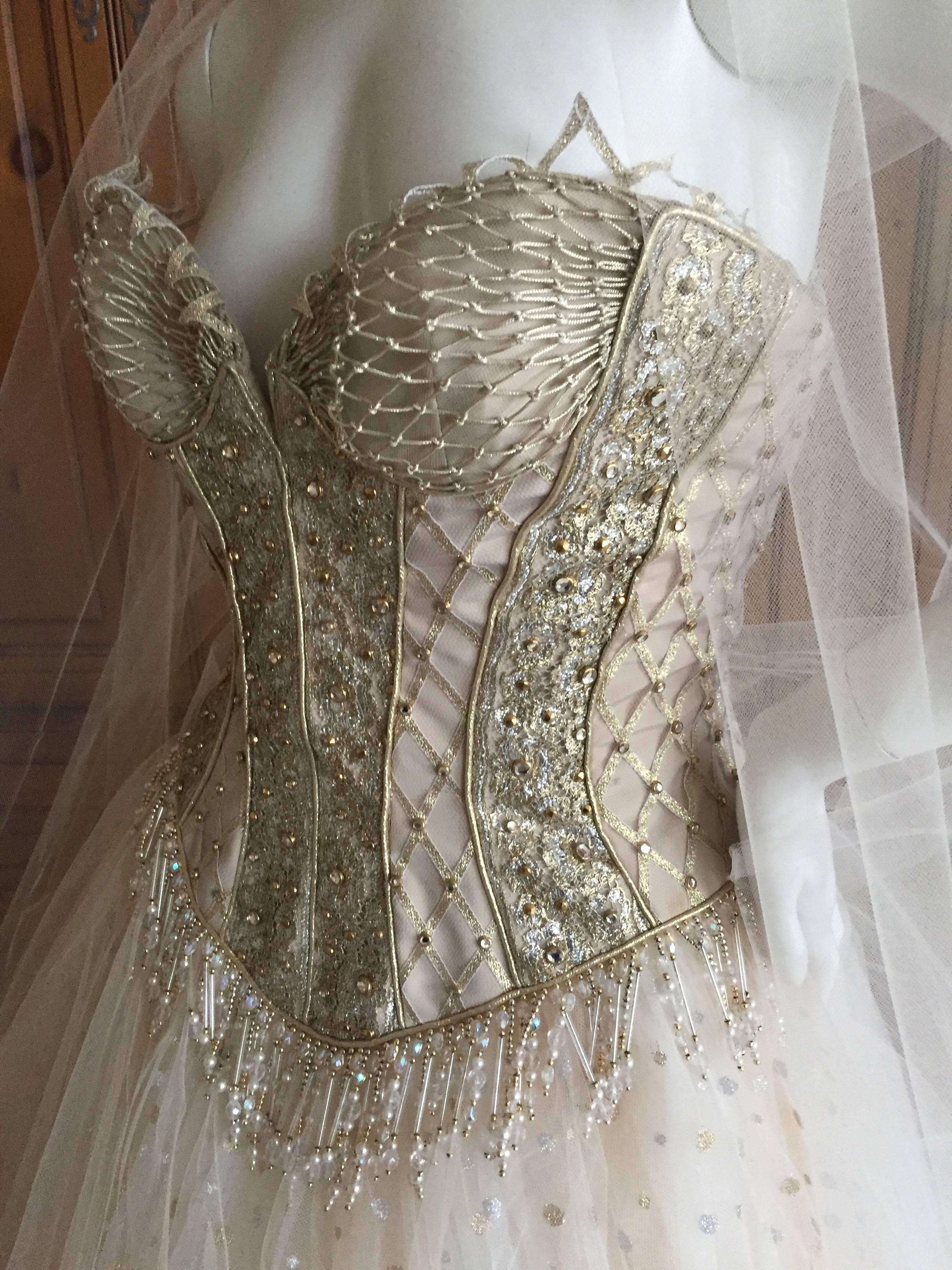 Bob Mackie dreamy ivory ballerina dress.
Ivory with silver and gold accents, with light brown topaz crystals
This is so romantic, the skirt is very full with under layers expertly draped.
The corset top is embellished with crystals overlaid on
