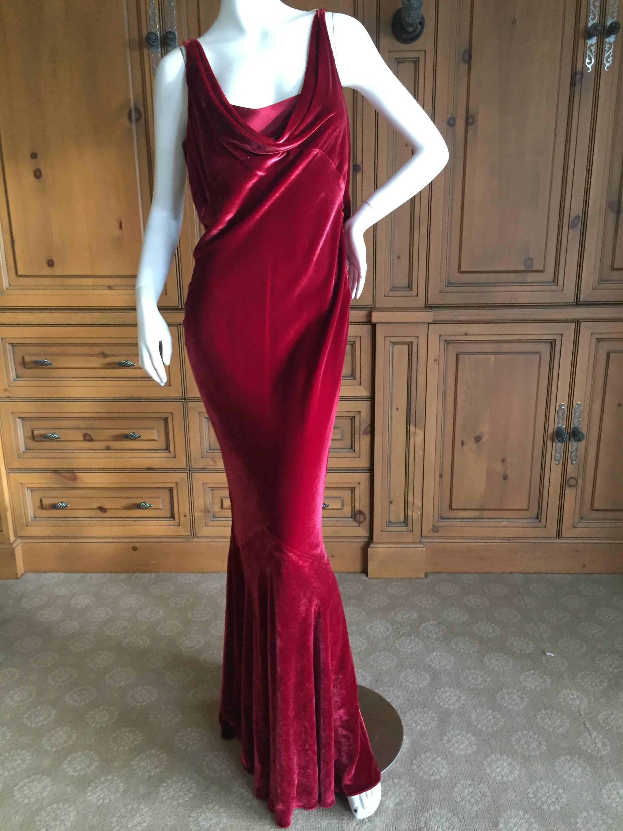 Superb bias cut burgundy velvet gown from John Galliano.
Featuring a low cut sheer back with embroidered carnation tattoo pattern, so chic.
This is one of my all time favorite Galliano dresses, it is so romantic.
Size 44 Fr US 10
Bust 41