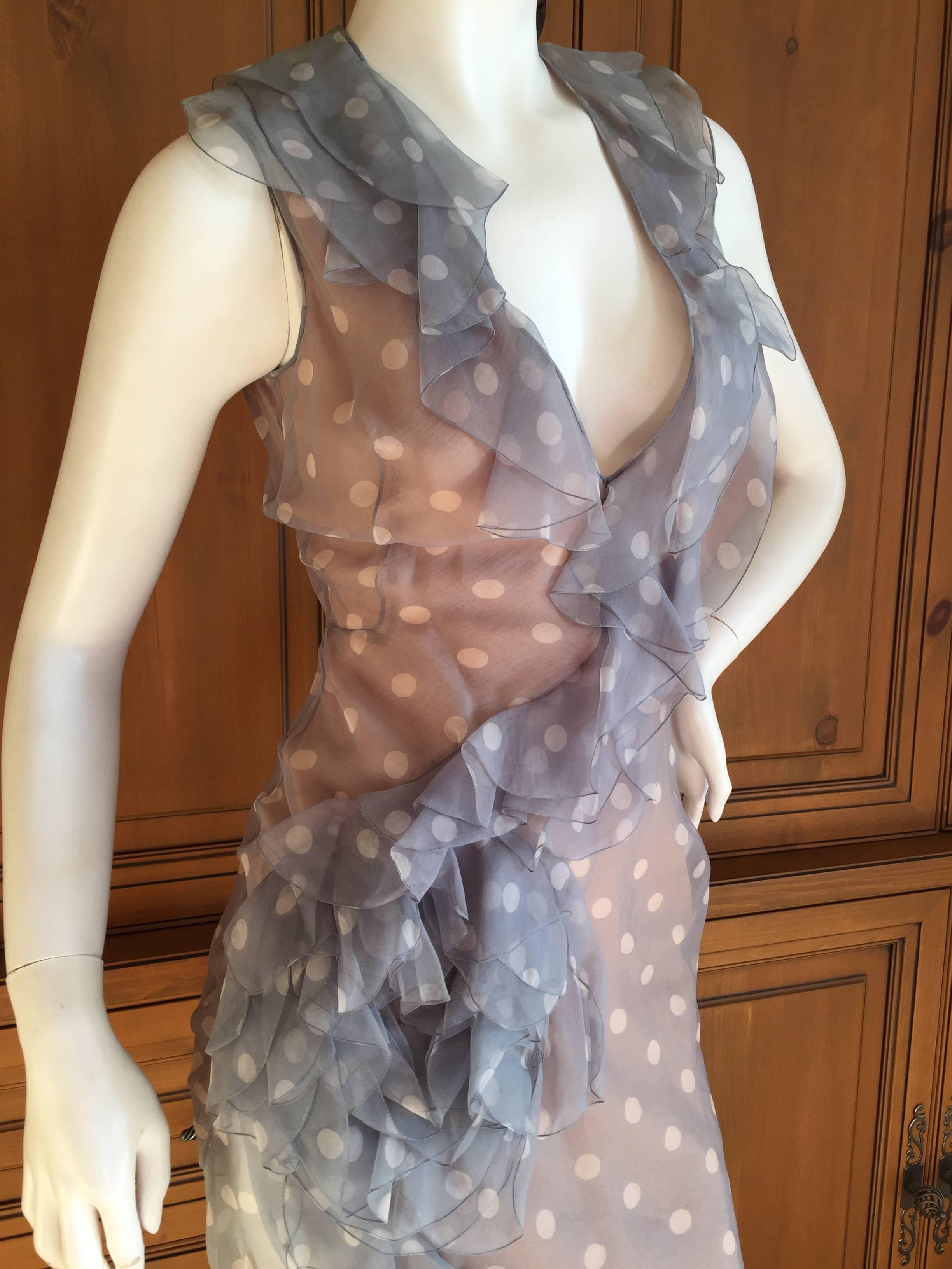 Romantic early John Galliano ruffled dress, unworn, new with tags from Barneys.
Sheer polka dot silk with ruffled flounce , it buttons up the side.
The sheer chiffon silk is lined in some places , sheer in others.
Marked 36 / 6
Bust 39