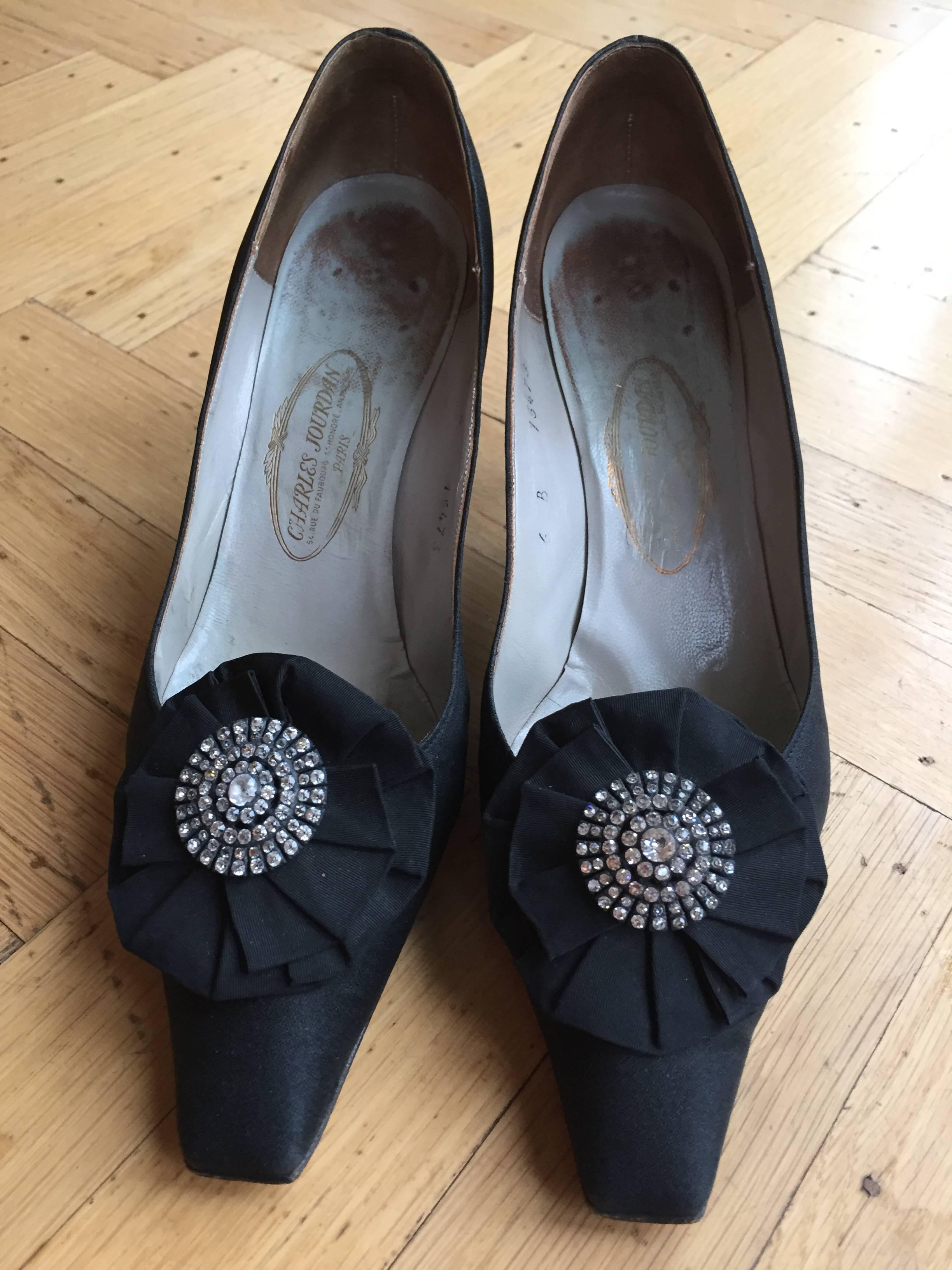 Beautiful black silk pumps with jeweled florets on the toes from Charles Joiurdan , designed for Christian Dior Couture 1959.
 Made to measure for Eleanor.
She wore size 6 and 6 1/2
From the collection of Eleanor Louise Christenson de