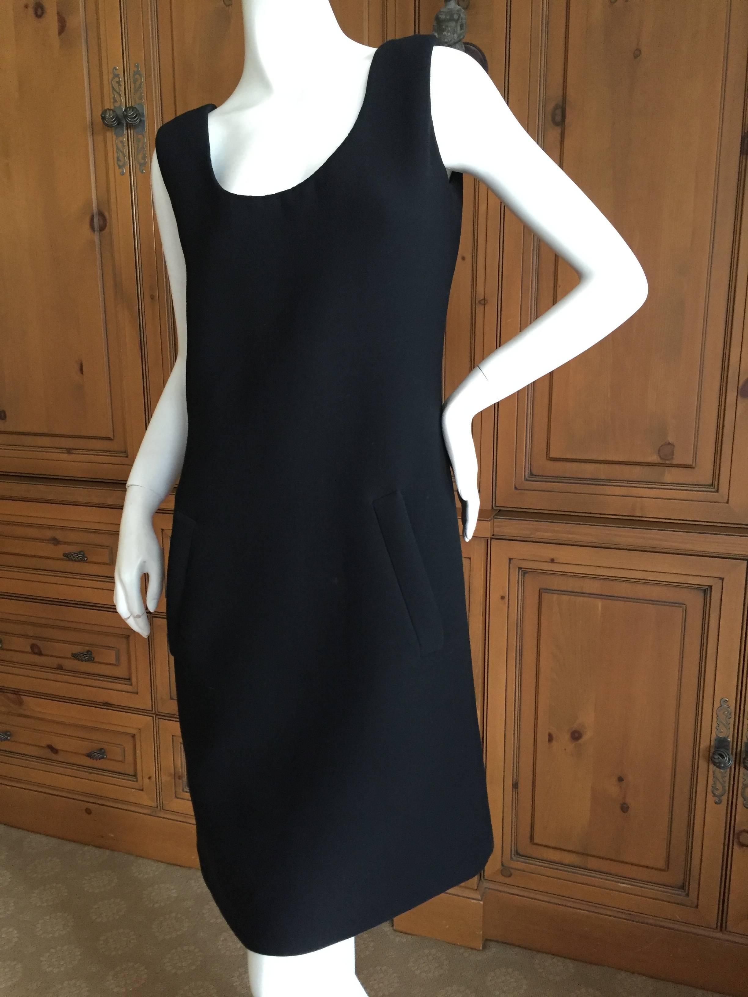 Norman Norell Black Scoop Back Button Dress.
Fully lined in silk.
Tag reads Norman Norell for I. Magnin
Bust 36