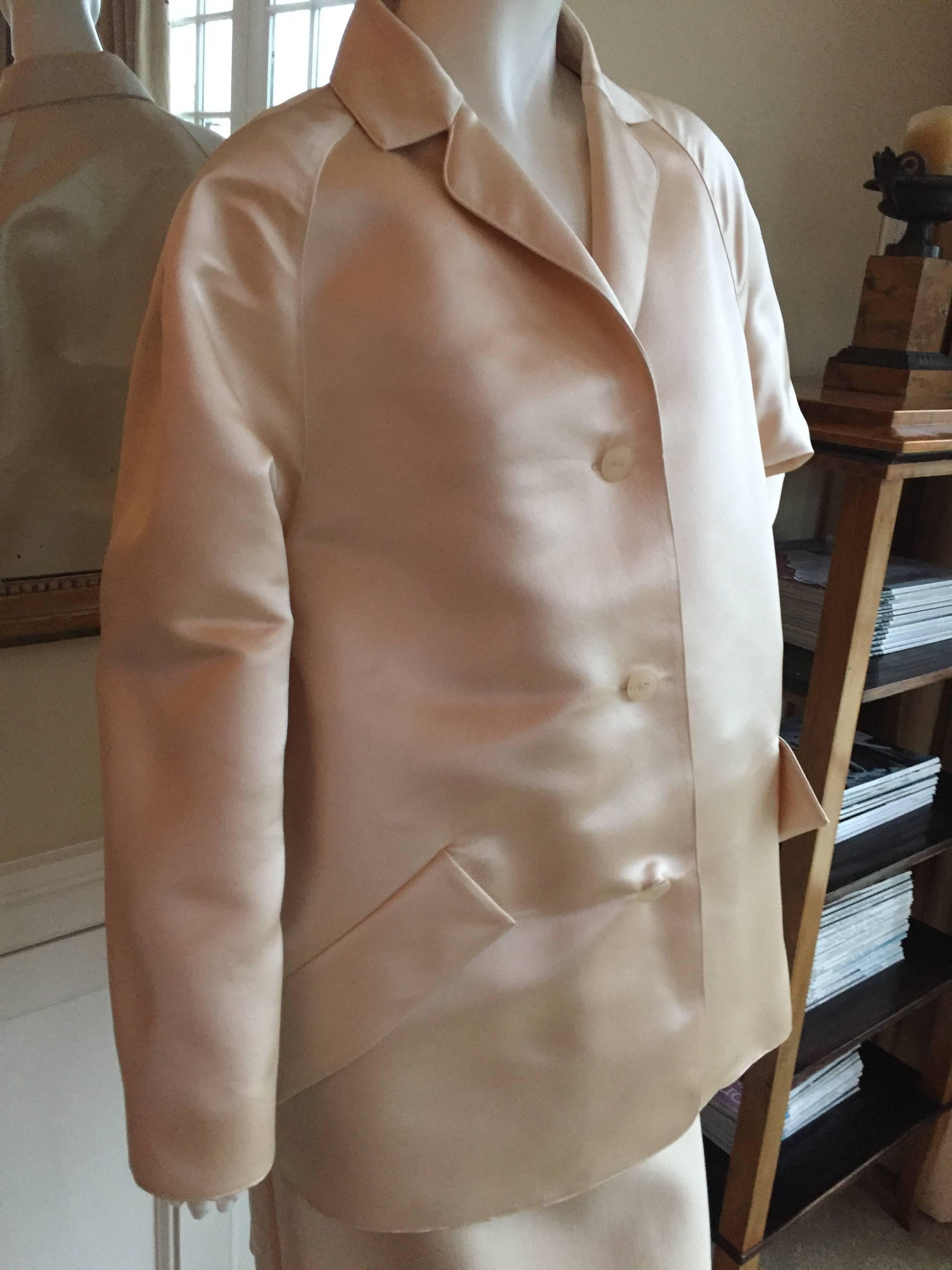 Beautiful cream colored silk satin evening jacket from Geoffrey Beene.
Size 10