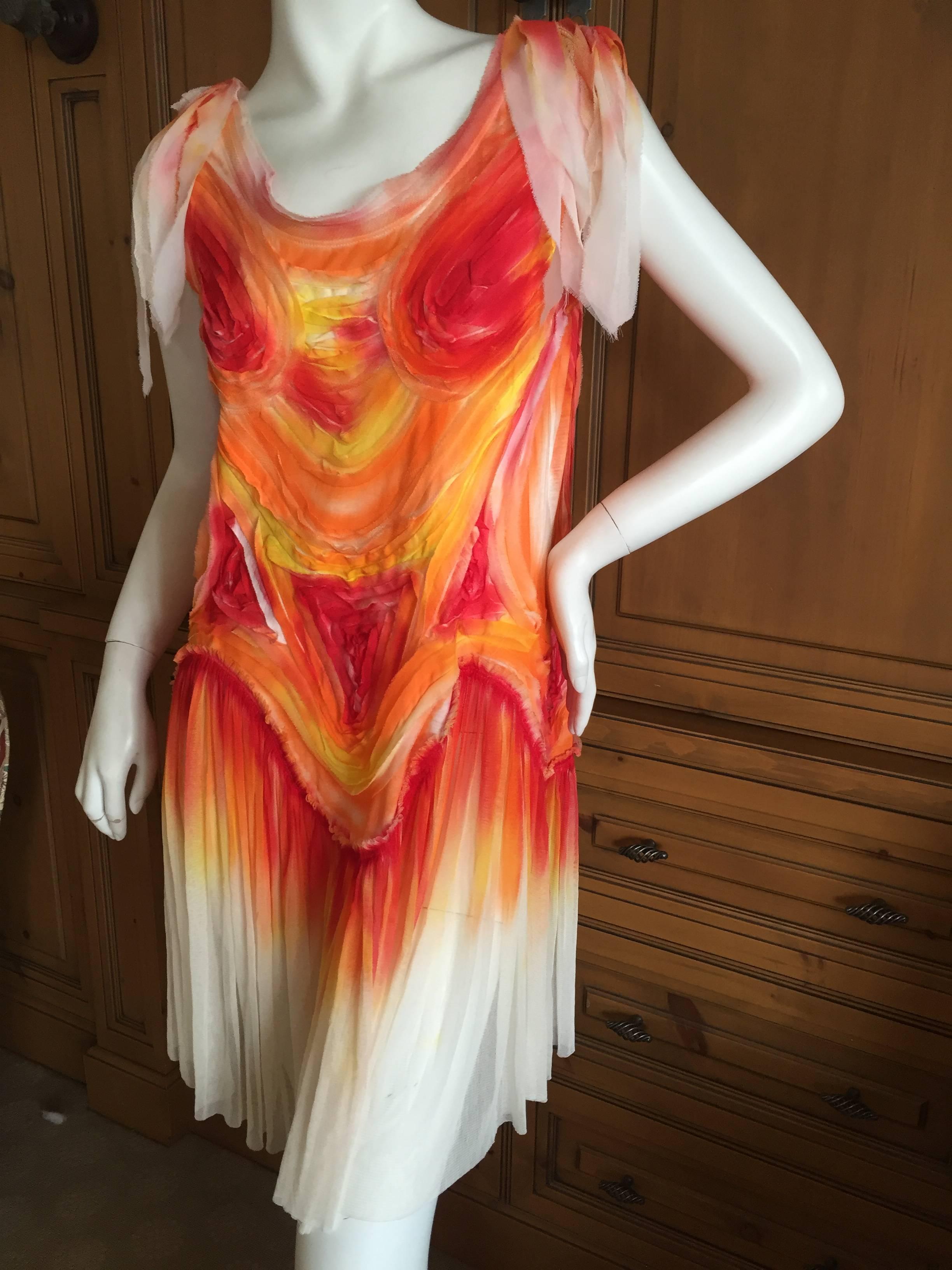 Unusual tie dye silk dress from Issey Miyake.
Created of wildly colorful silk in shades of yellow orange and red, evocative of fire.
Size 3, there is som e stretch in this .
Bust 39