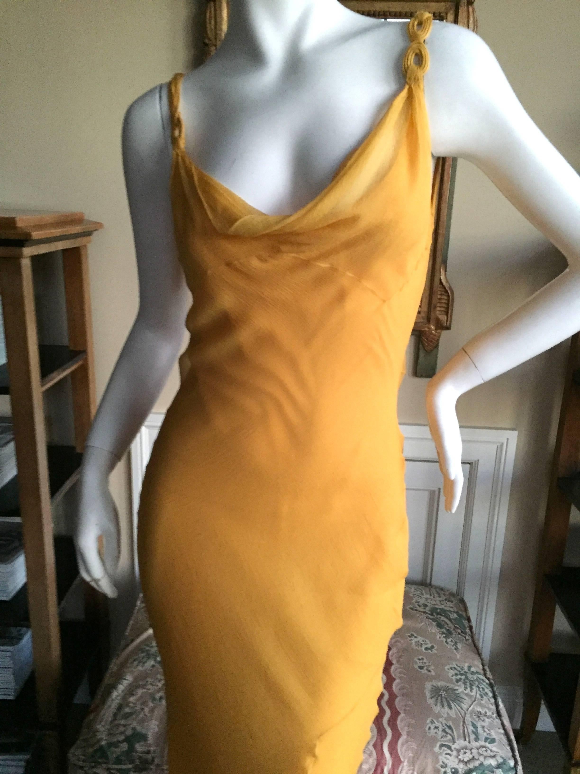 Beautiful bias cut silk chiffon dress in a rich marigold orange from John Galliano.
Size 38
Bust 38