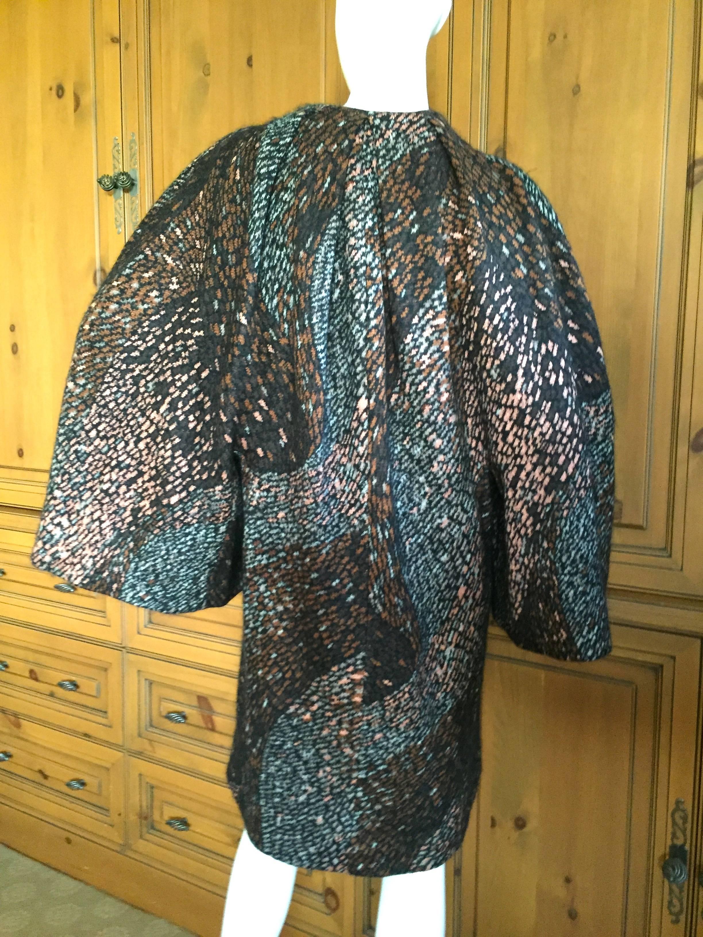 Darkly romantic cape coat from Missoni circa 1990.
Patterned in a mosaic like effect, this is an extremely soft blend of wool silk and mohair.
Bust 44