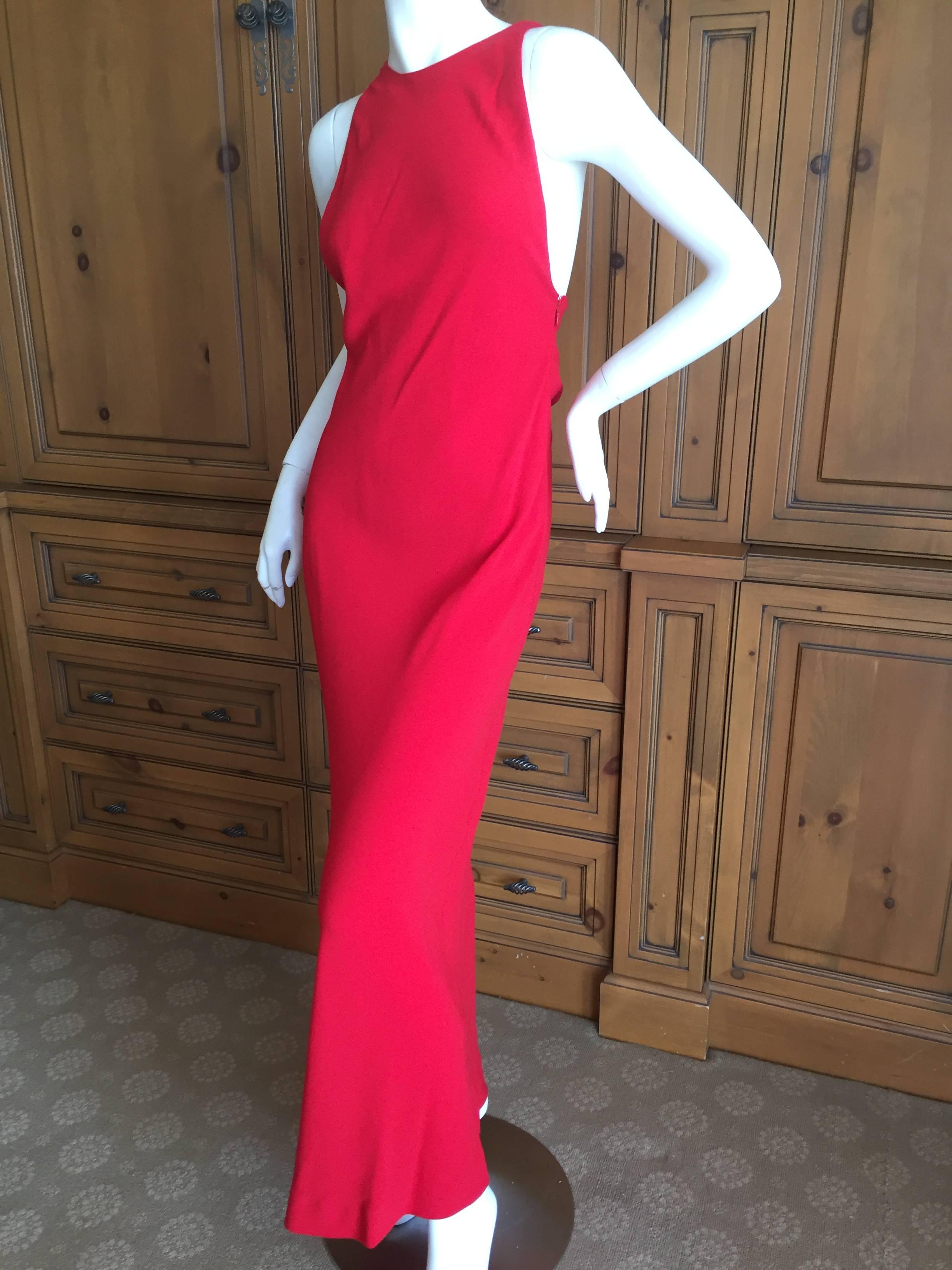 Sultry red evening dress from Yves Saint Laurent Rive Gauche circa 1990.
This is so modern and chic, a perfect Valentine dress .
Low cut arms, with a very sexy back, this is Yves final era at his best.
Size 38 
Bust 34