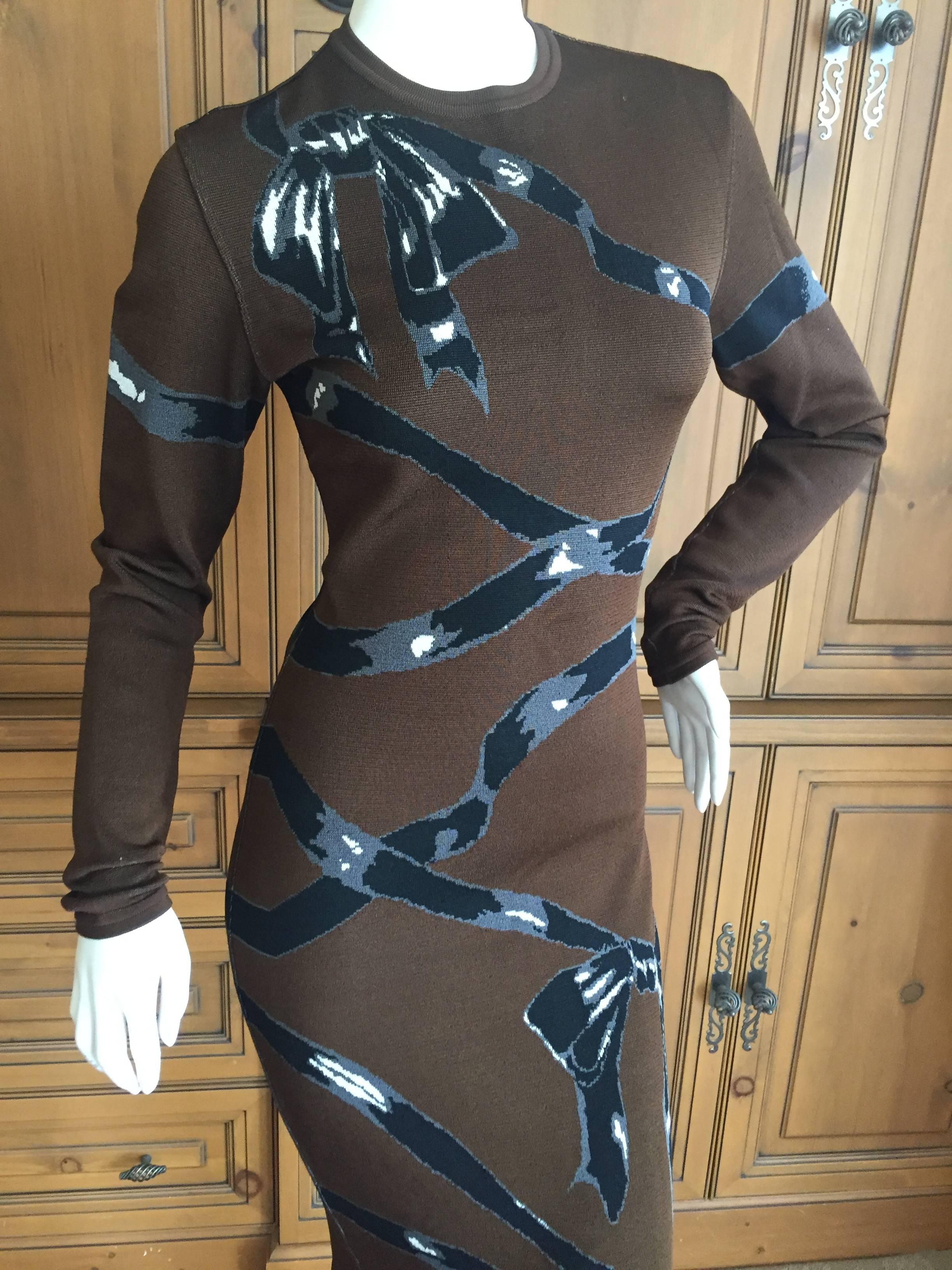 Wonderful late 1980's bodycon knit dress from Azzedine Alaia.
Inartsia pattern of black ribbons and bows on a brown background.
In excellent condition. 
Marked Size M.
There is a lot of stretch in this, the measurements are un stretched.
Bist