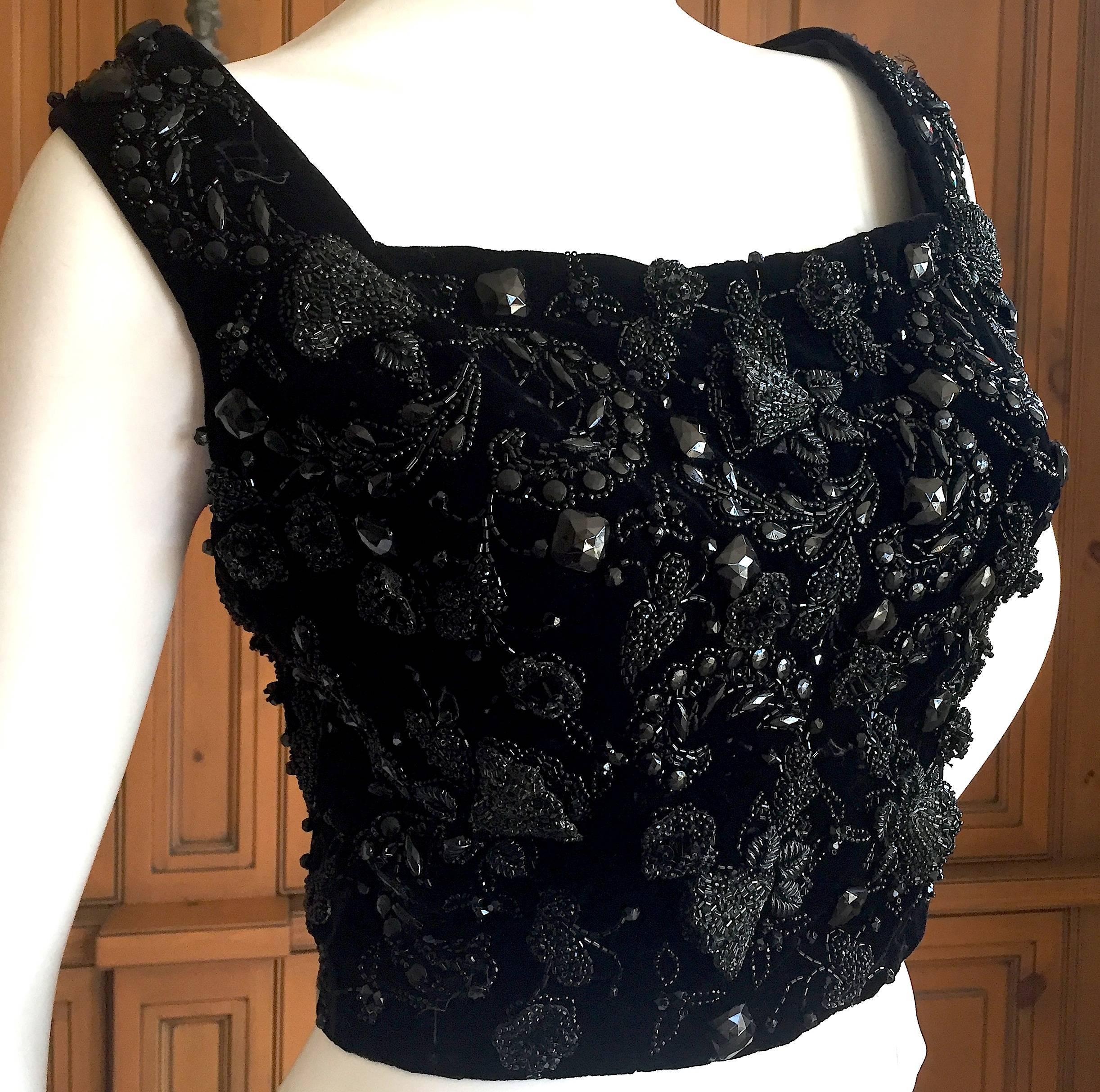 Magnificent black velvet top with superb jet beading from Christian Dior-London circa 1958.
Amazing beadwork, the label reads Christian Dior -London, Modele Original and is numbered.
Corset style hook eye closures up the back.
Bust 38