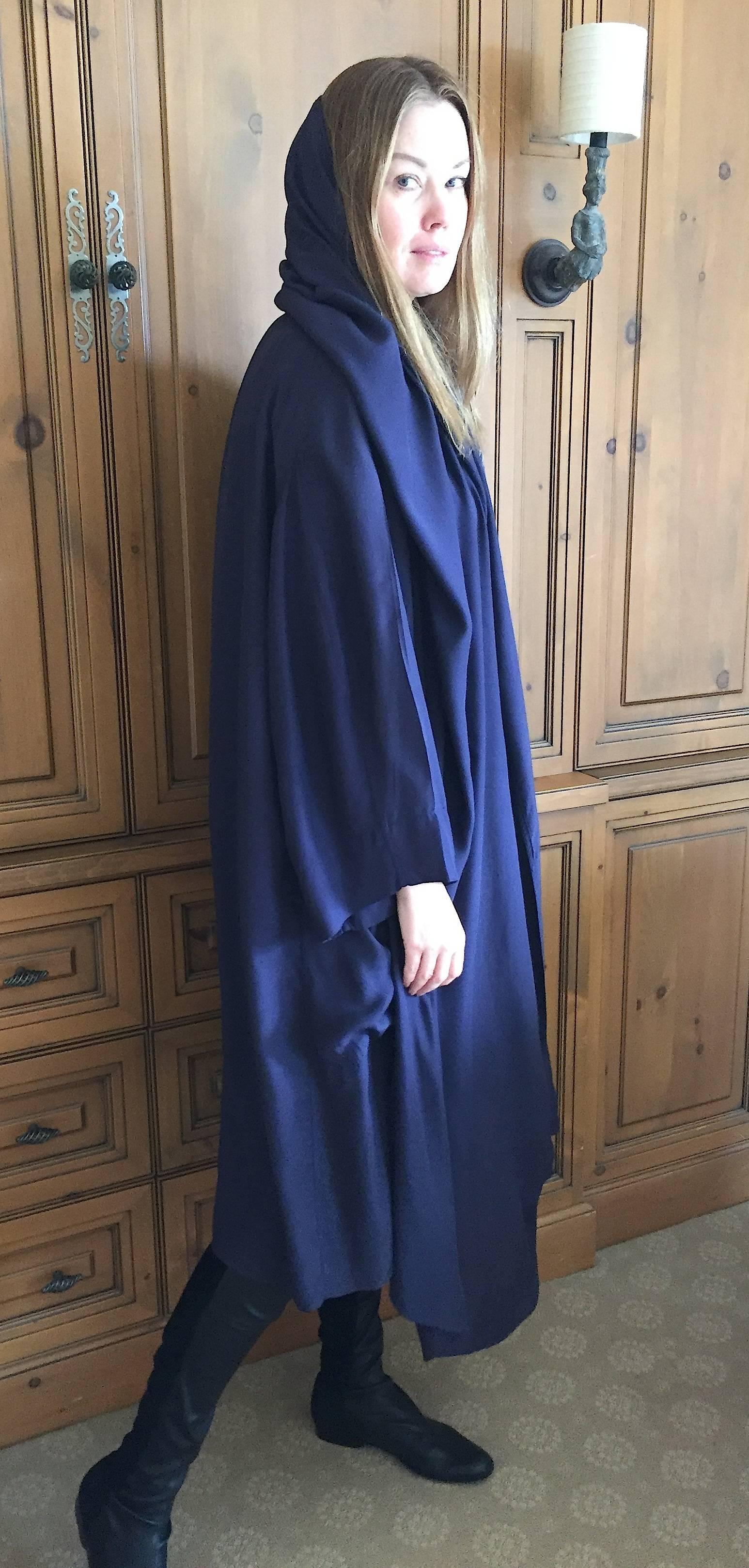 
Rare 1980's Azzedine Alaia hooded coat.
 In the 1980's Alaia was known for dressing Grace Jones, 
who loved to wear his hooded coats and dresses.
It is also unusual that it is so loose fitting, it complements his dresses.
It has a very