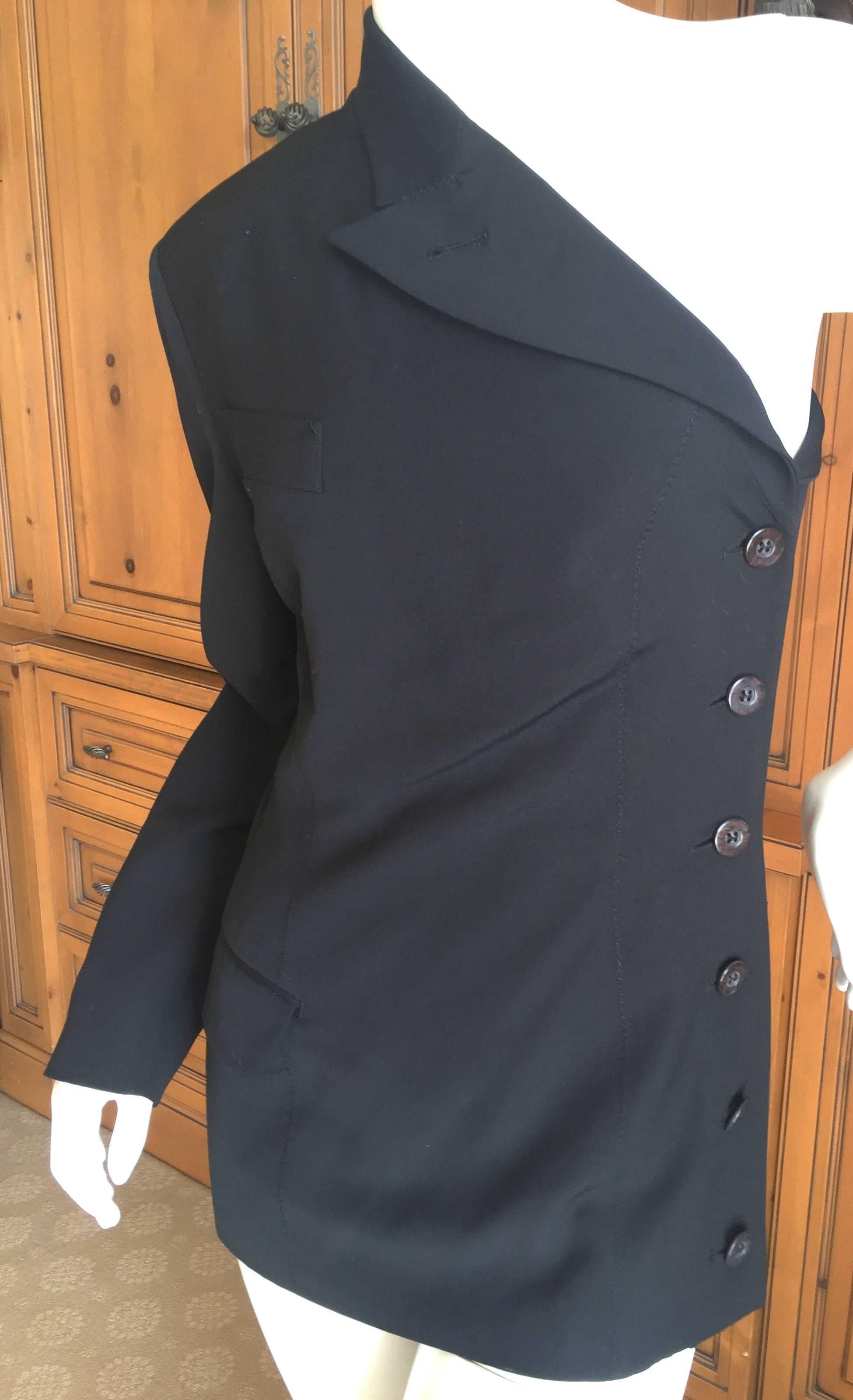 Witty and wonderful one sleeve jacket from Jean Paul Gaultier.
This is a very early version of this, the one sleeve blazer, that Gaultier visited throughout his career .
Bust 36"
Waist 28"
Length 27"