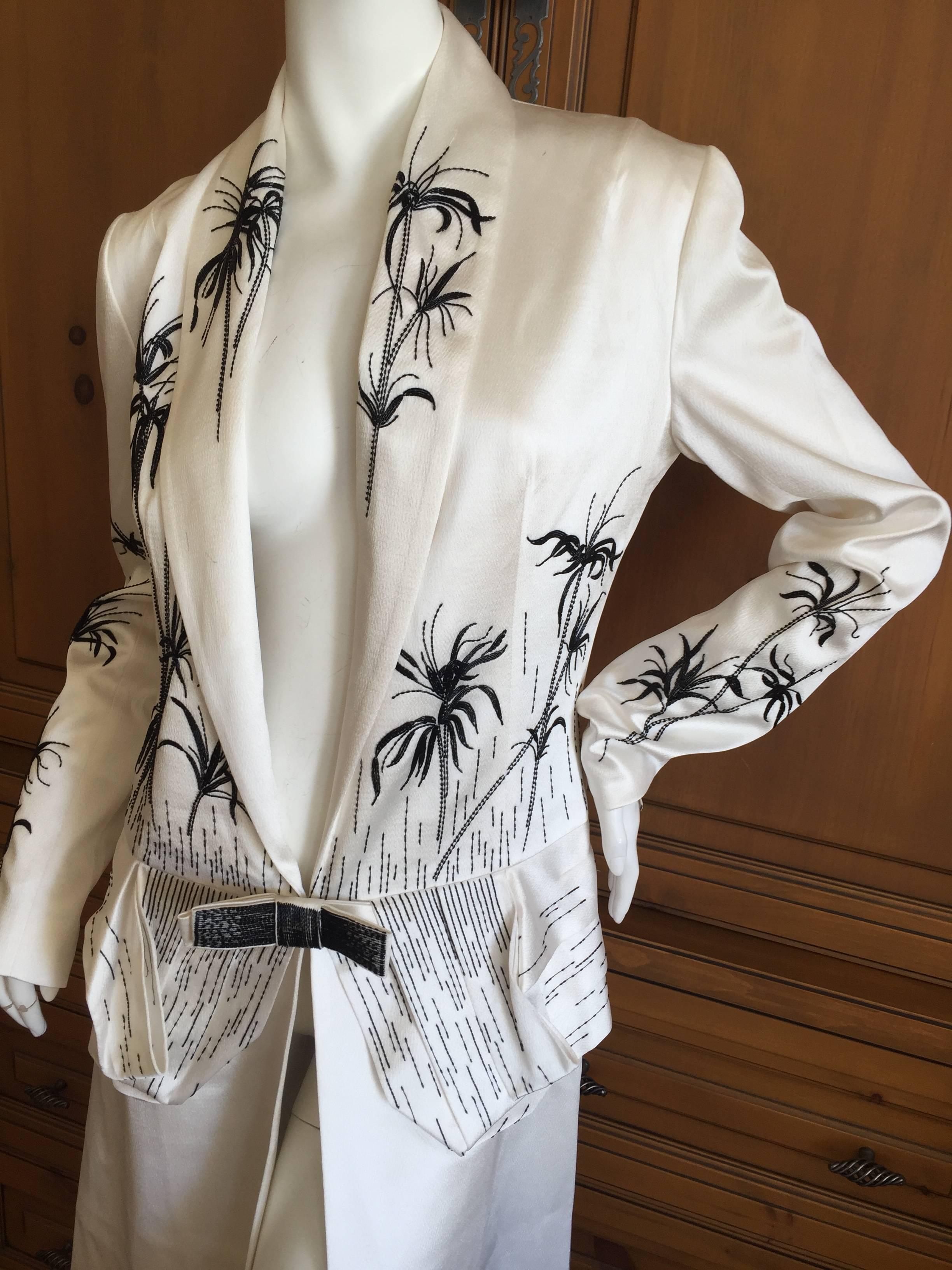 Christian Dior by Gianfranco Ferre White Hammered Silk Beaded Evening Coat.
Exquisite white coat with beaded flowers created from tiny white bugle beads.
This was created by Gianfranco Ferre in the early 1990's for Christian Dior.
It still has