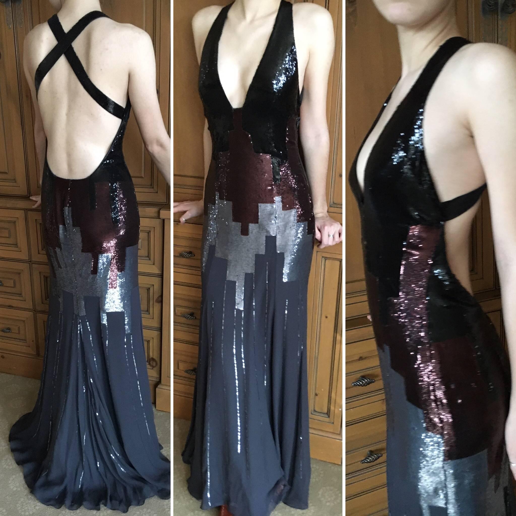 Amazing vintage sequin gown from Versace.

This has a mesh bodysuit inside. 

The original store tags still attached, the original retail was $9835.

 Sizzling hot, with low cut bust, embellished with a cityscape in sequins .
Please use zoom