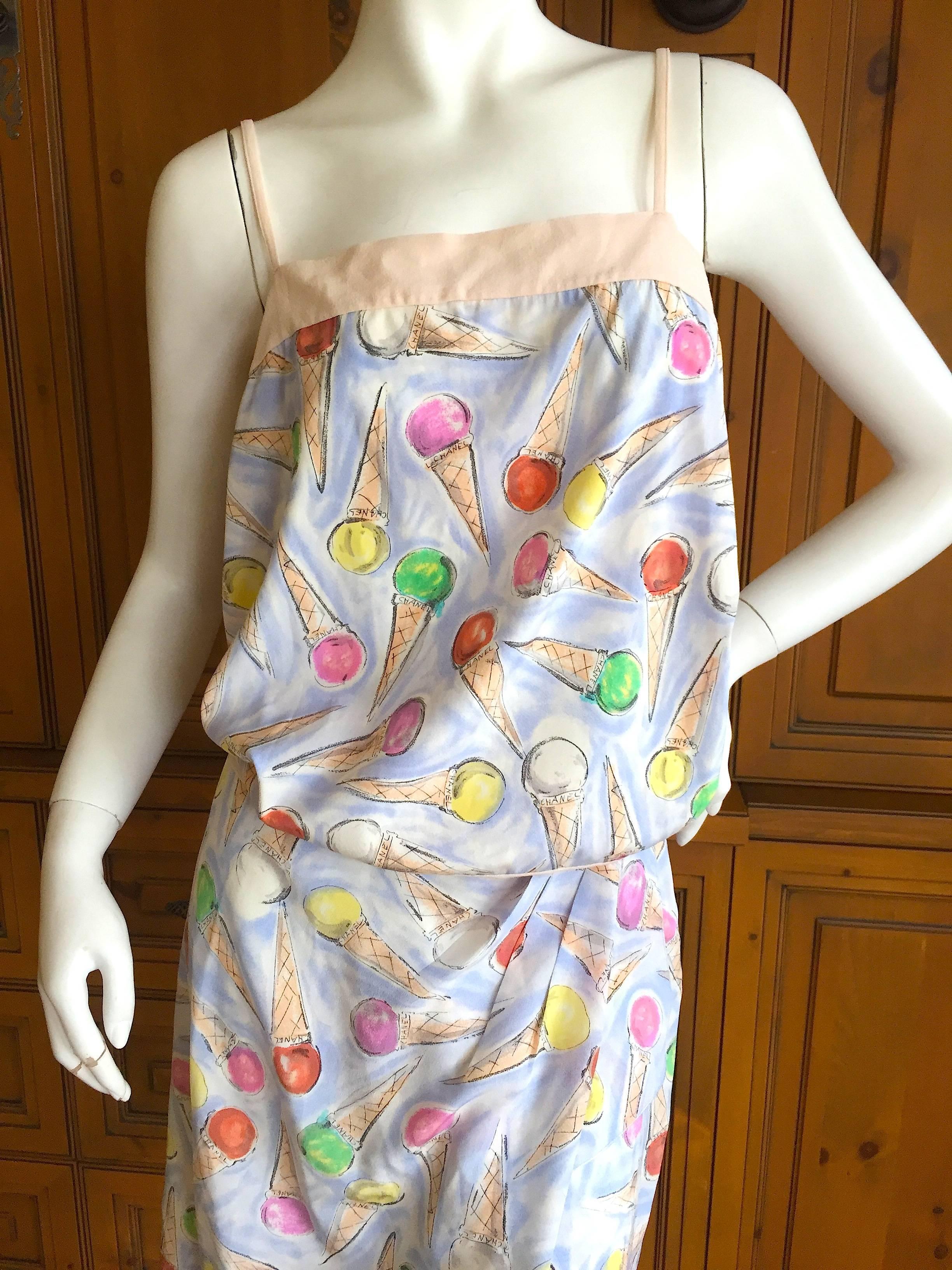 Lovely ice cream con print top and skirt by Karl Lagerfeld for Chanel.
The skirt has a high slit, and the top has a revealing keyhole back.
From Cruise 2004.
Size 38
Bust 36
