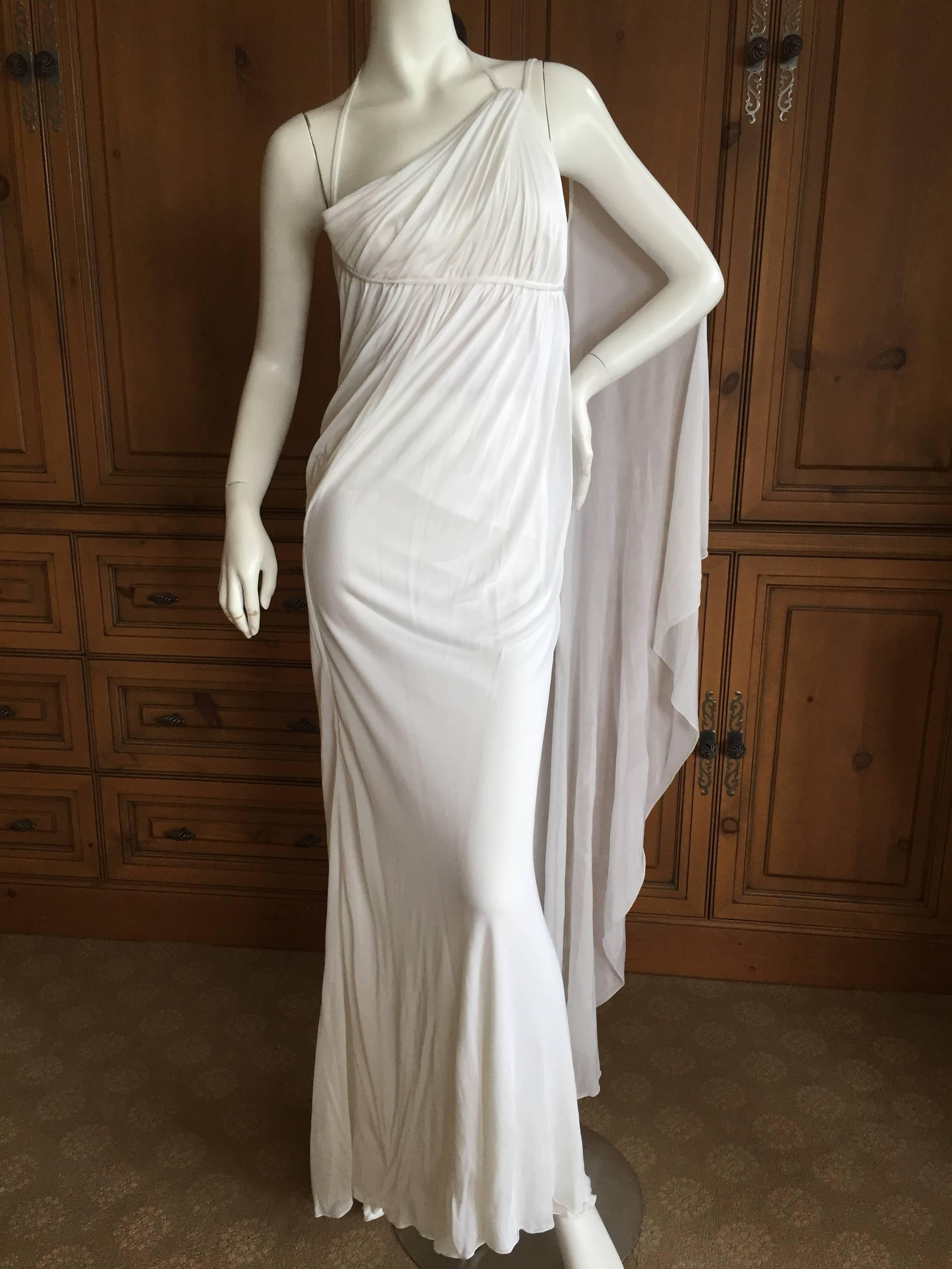 Gorgeous vintage white goddess gown from Versace.

The original store tags still attached.

There are multiple layers of fabric, some sheer.

Please use zoom feature to see details.

Size 42 (runs small)

Bust 36