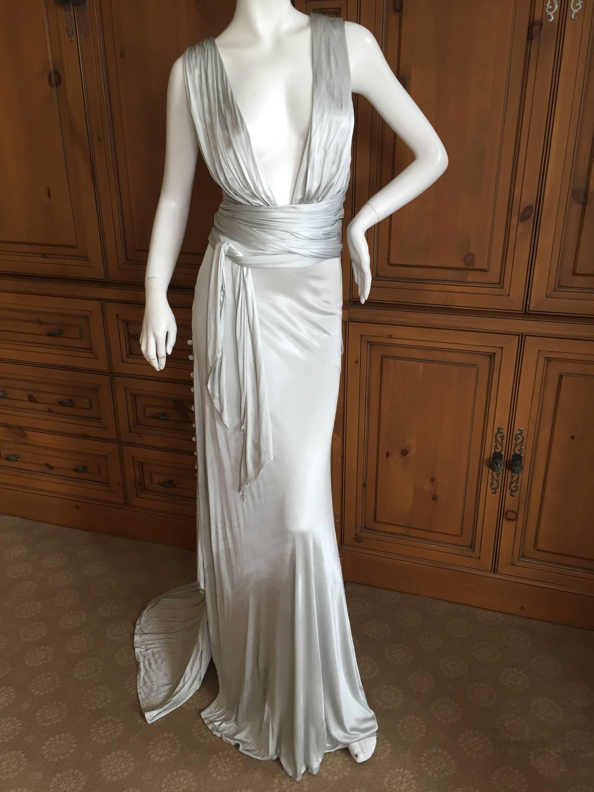 Amazing vintage jersey evening dress from Versace.

Very low cut in front, it crosses in the back and has two very long scarf ties, which I show wrapped around the waist.

This has a mesh bodysuit inside. 

 Sizzling hot, Vintage Versace at