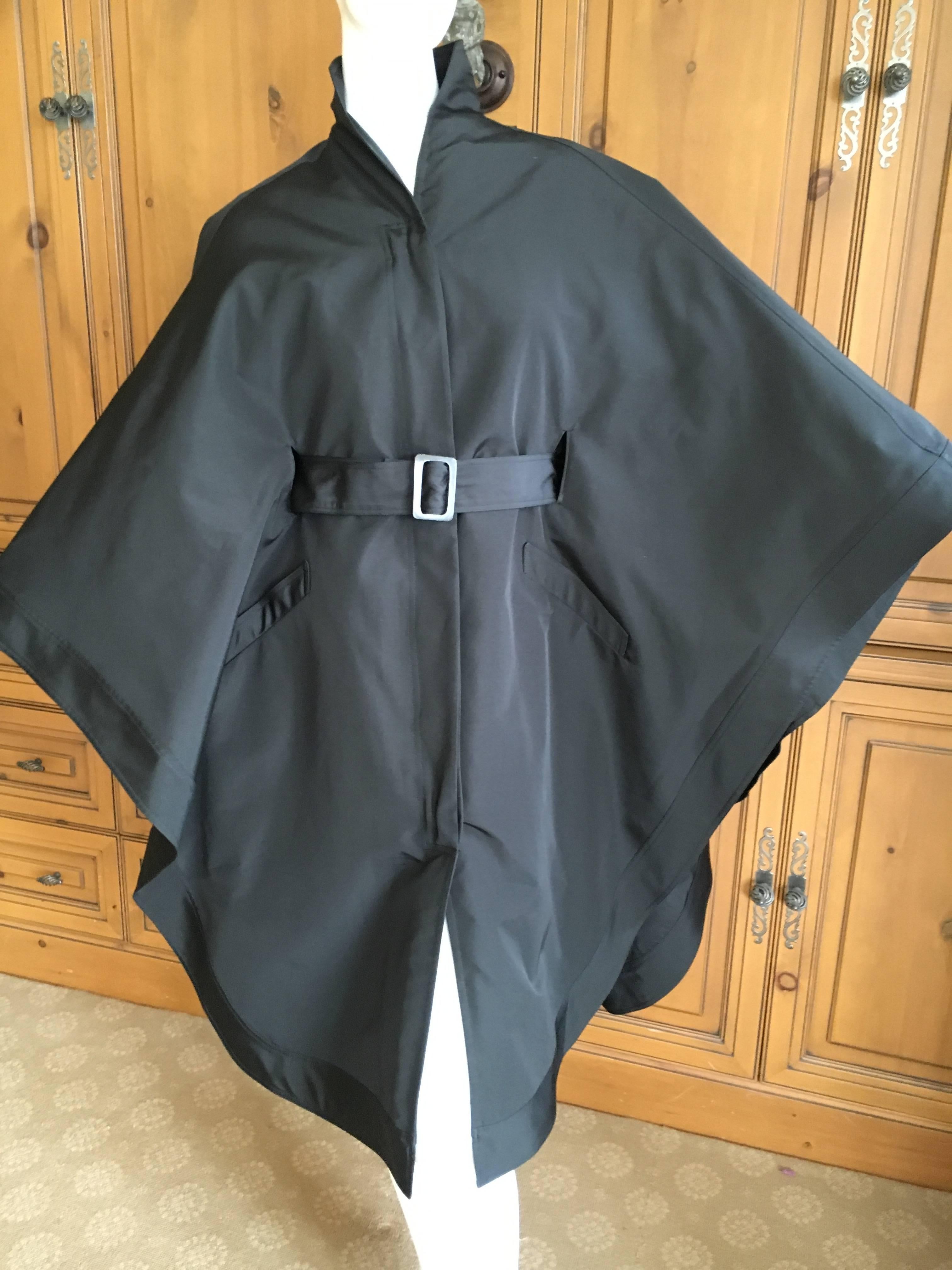 Magnificent cape coat from Chado Ralph Rucci.
This has sleeves underneath the cape, and a matching belt.
I'm not certain what the fabric is, there is no fabric tag, feels like taffeta.
So much prettier than the photos.
Size 8
Bust 38