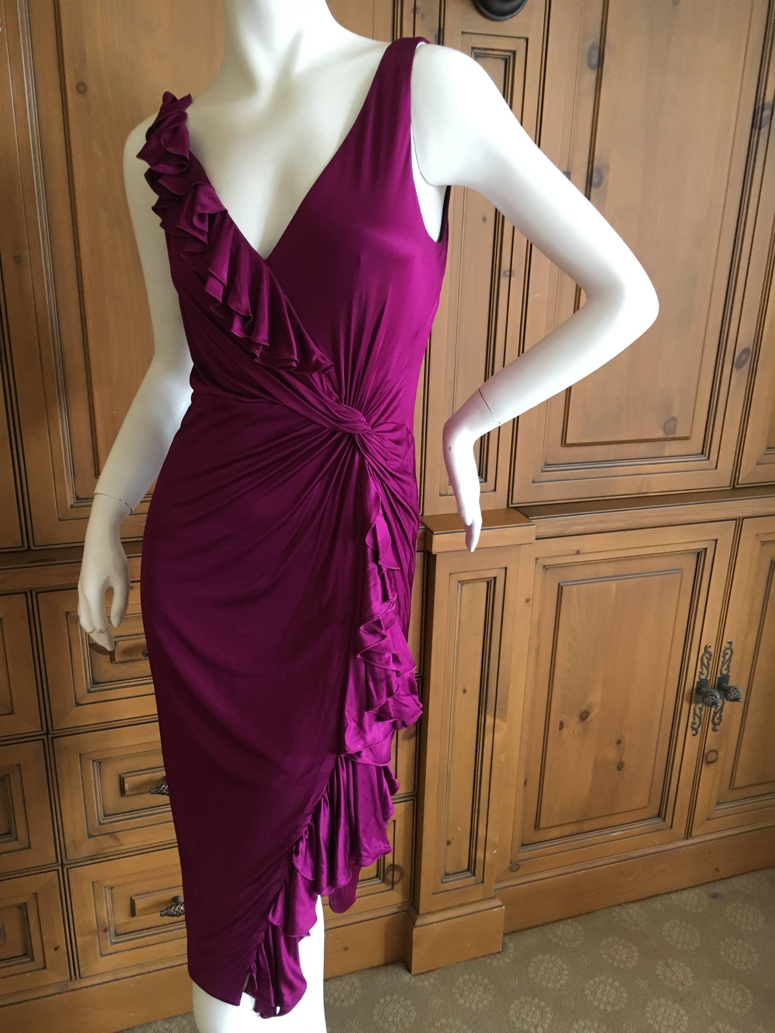 Luscious purple jersey dress with ruffle trim from Versace.
Size 42
Bust 38