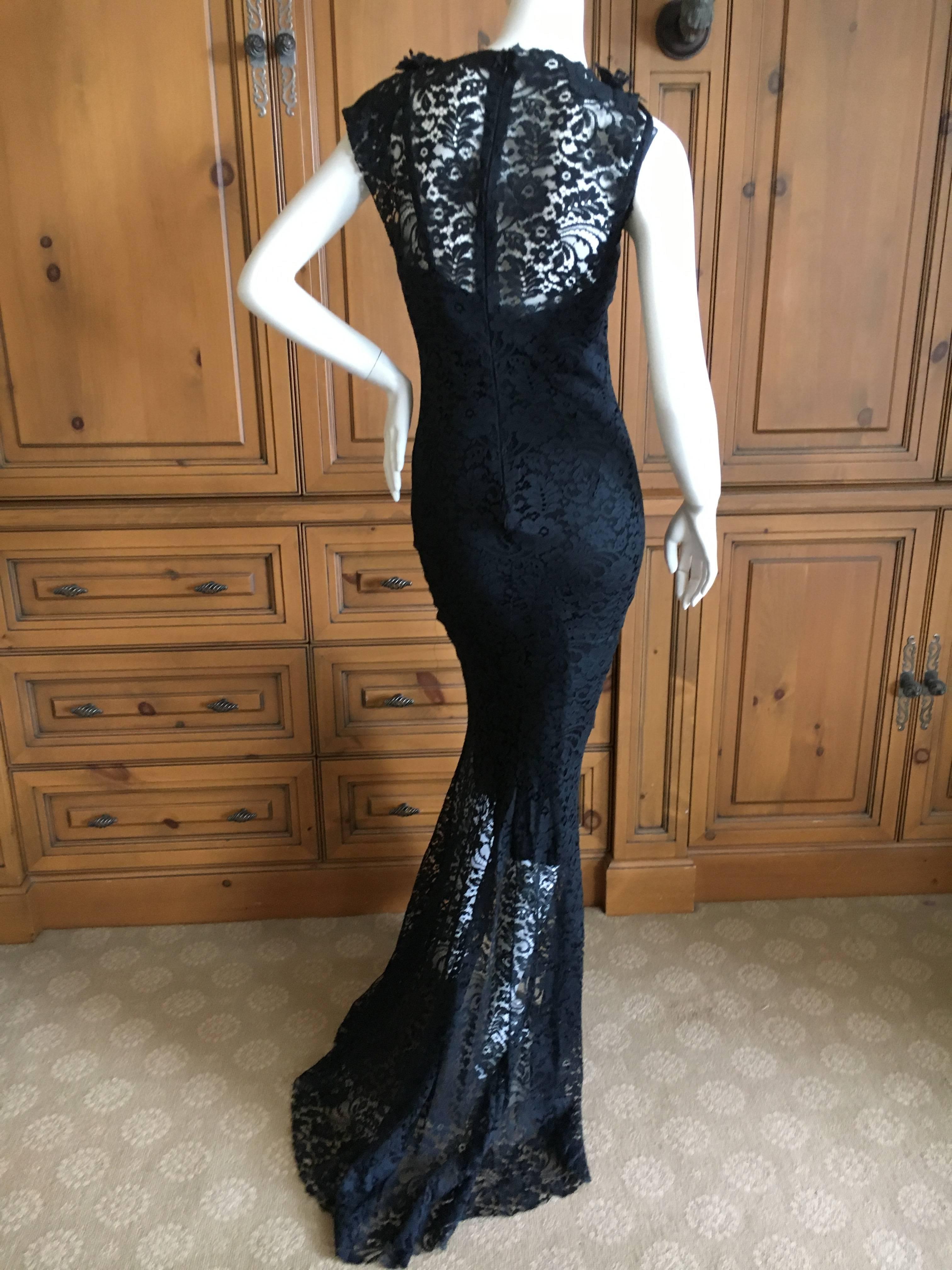 Exquisite lace evening dress by John Galliano for Christian Dior.
Purchased at Bergdorf Goodman in 1998, this has an under slip dress that is also wearable without the over layer. Two dresses in one purchase.
There are floral lace embellishments