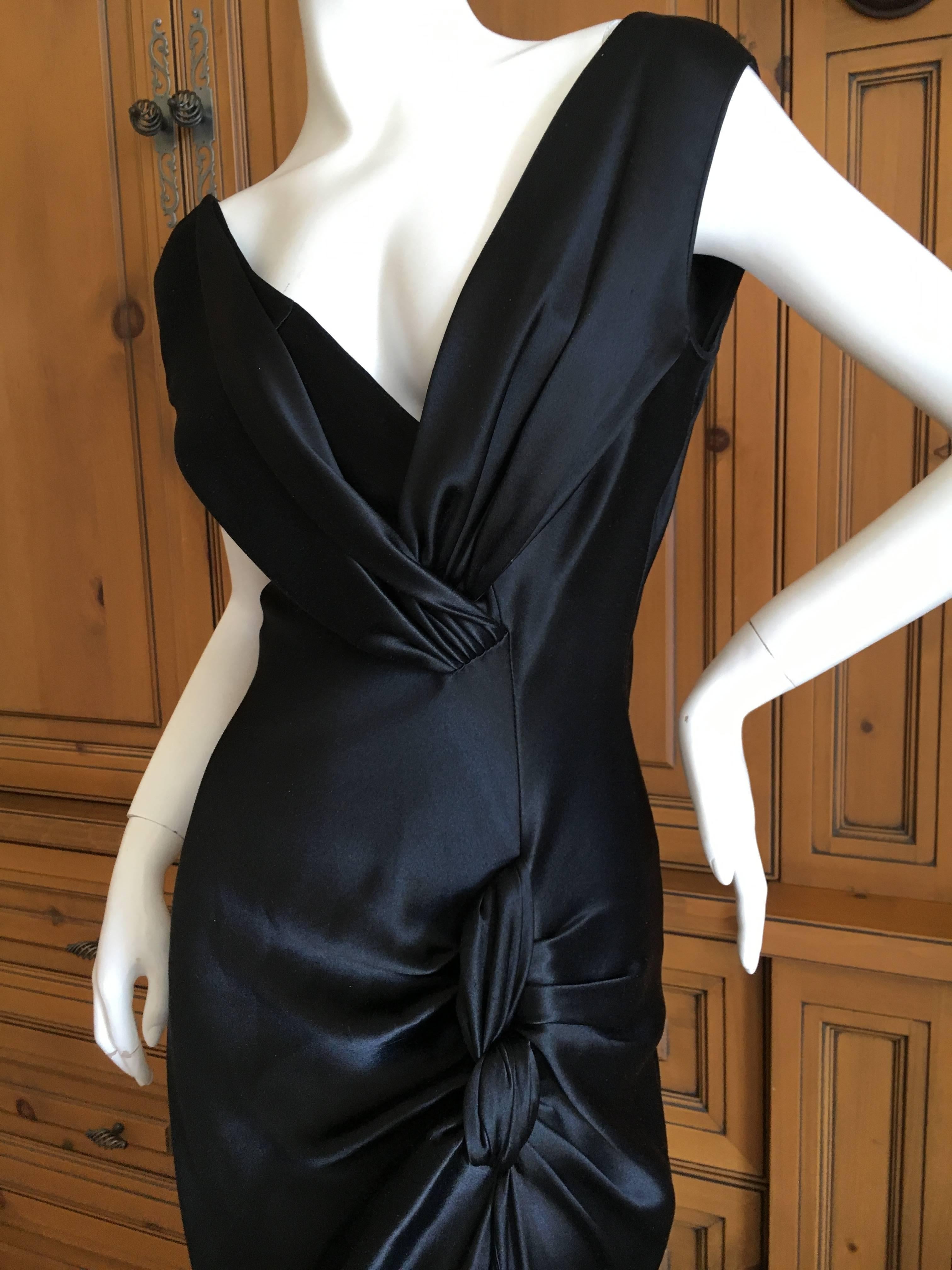 Christian Dior by John Galliano Bias Cut Silk Evening Dress with High Slit.
There is no zipper on this, or tortuous Galliano buttons, it slips over ones head.
Size 36
Bust 38